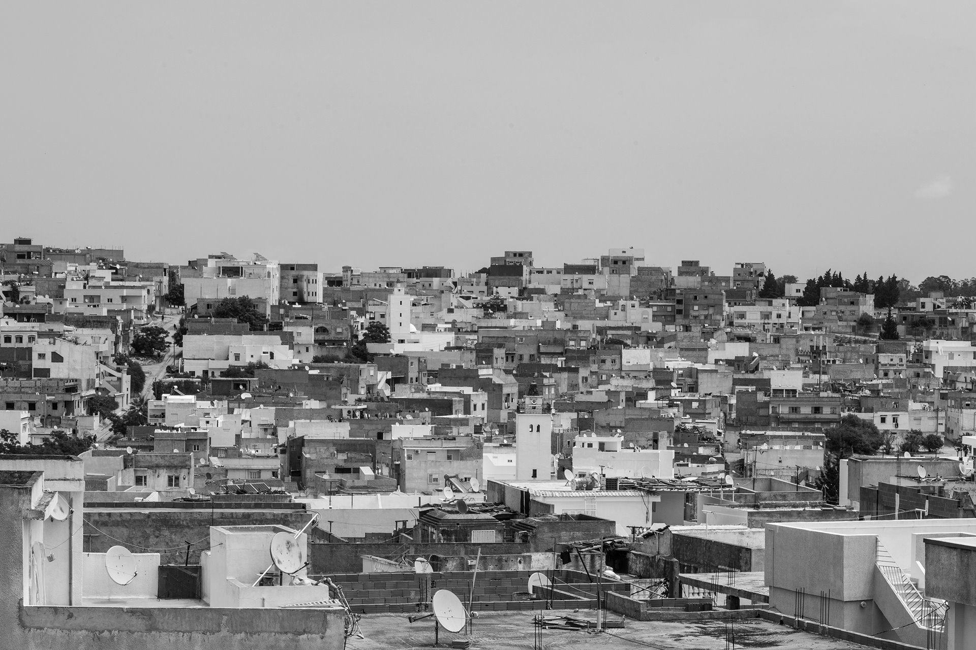 Jebel Lahmar, a neighborhood on the outskirts of Tunis, Tunisia, has grown haphazardly from a shantytown and is densely populated, with precarious housing and limited infrastructure.