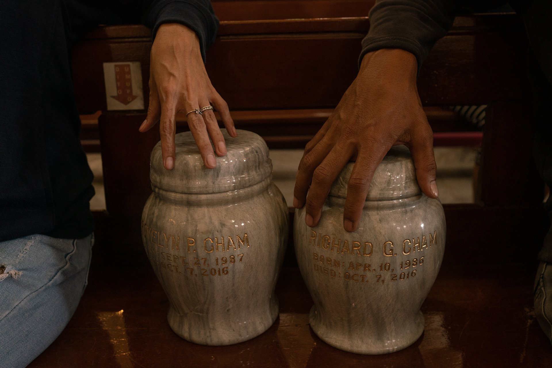 <p>The family of Rovelyn and Richard Cham receive the urns containing their ashes, in Tayuman, Manila, the Philippines. Unknown gunmen killed the couple at home in 2016.</p>
