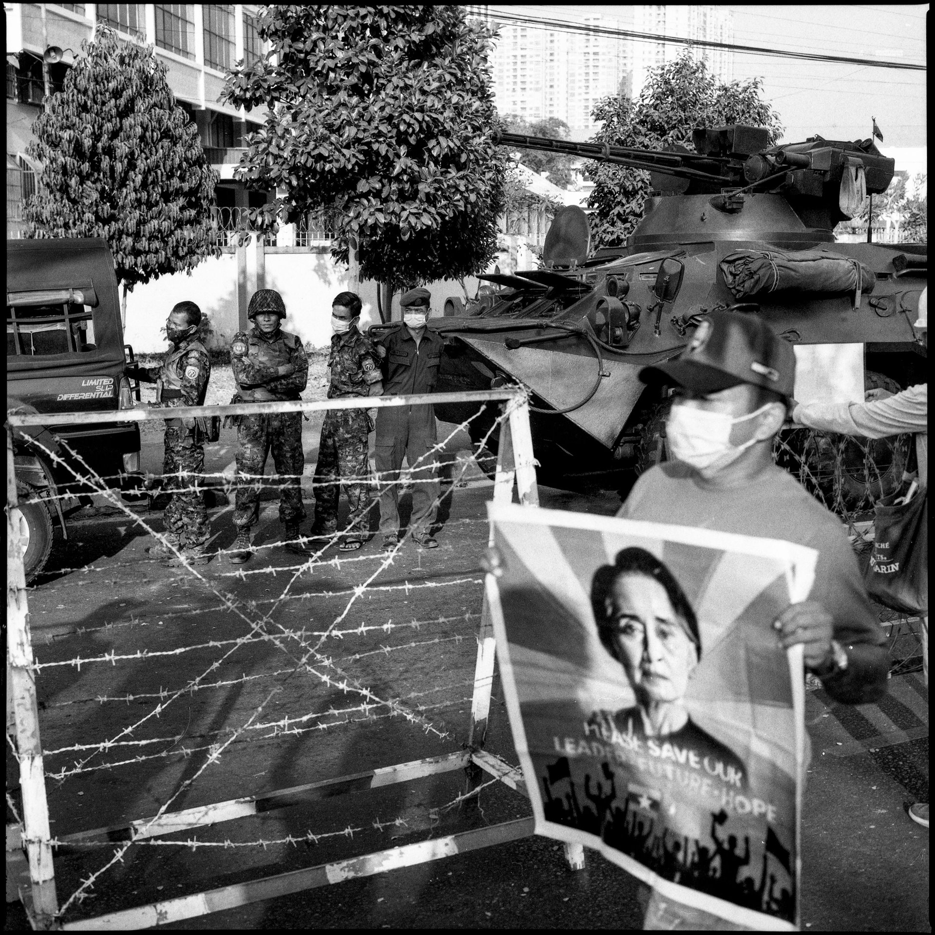 Protesters in front of the Central Bank of Myanmar in Yangon demand the release of political prisoners, including democratic leader Aung San Suu Kyi (pictured on the poster). Protestors also called for bank employees to join the civil disobedience movement. Many employees of private banks had already joined, causing branch operations to halt.