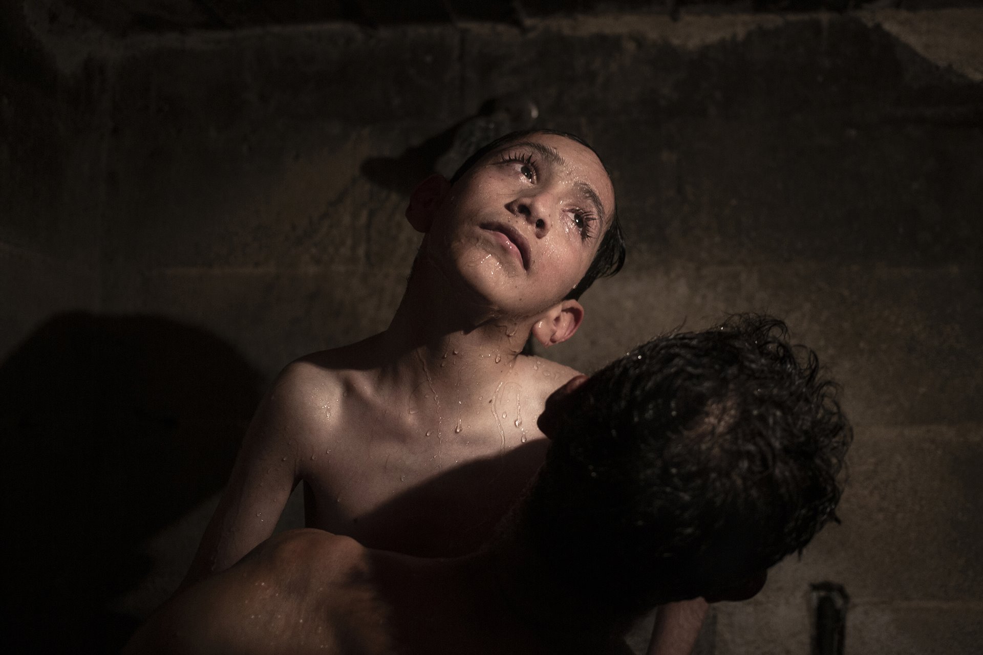 <p>Sebastián (18) baths with the help of his father Tino, in Villa Guerrero, Mexico. Sebastián lives with hydrocephalus, a neurological disorder caused by a build-up of fluids in cavities within the brain, and depends on his parents for most daily activities.</p>
