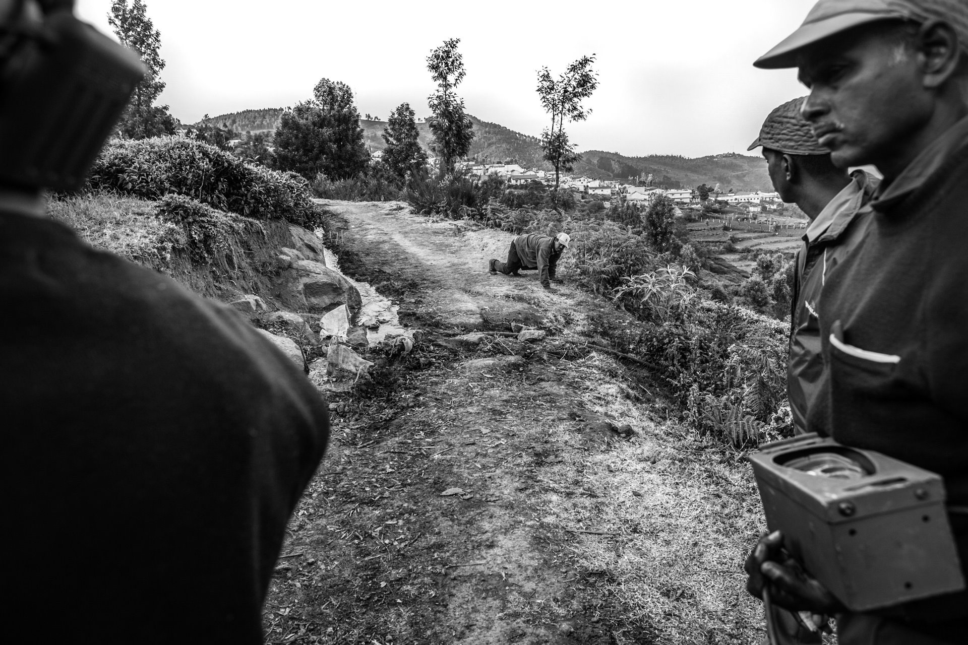 A task team places the camera trap to detect tiger activity near the Mudumalai Tiger Reserve, Tamil Nadu, India, following three lethal attacks on humans.