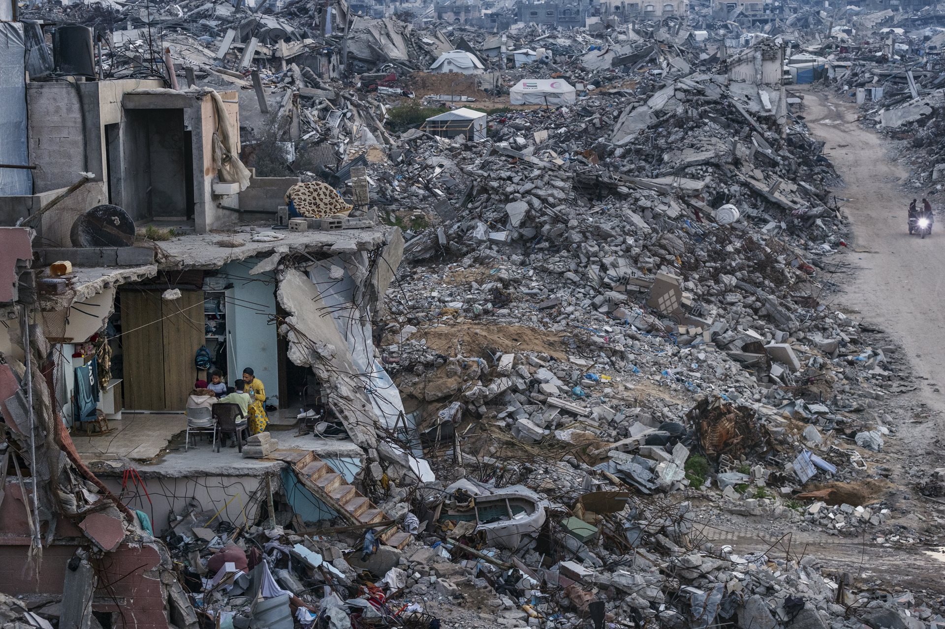 Tamer Hassan al-Shafei and his family break their Ramadan fast in the remains of their home in &nbsp;Beit Lahia, Gaza Strip. Food shortages meant only basics were served instead of the usual spread.