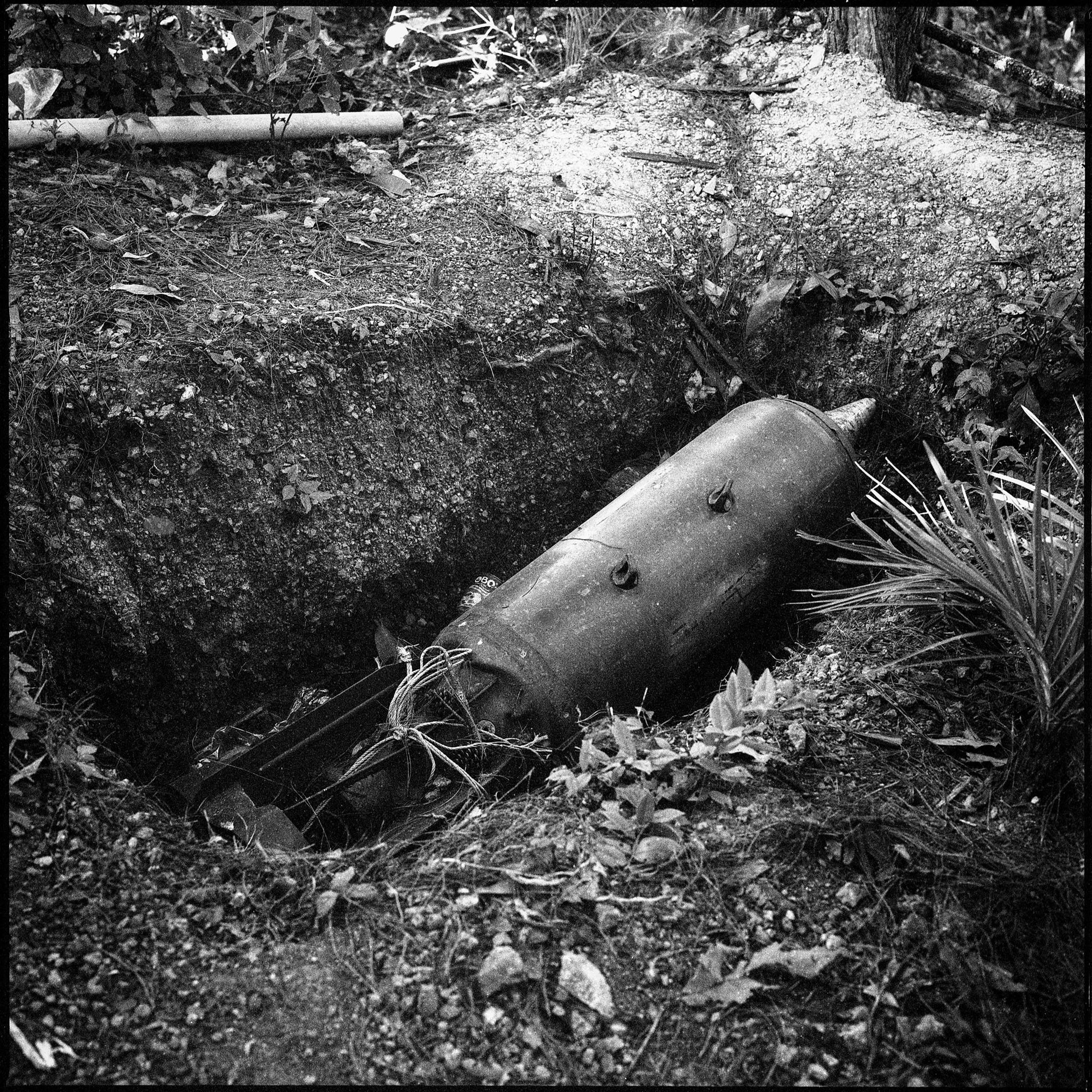 An unexploded bomb, dropped by a Myanmar military warplane, is seen at a remote camp of the Karenni Nationalities Defence Force (KNDF) in Kayah (Karenni) State. Between February 2021 and September 2022, 157 civilians were killed and 395 injured by such unexploded ordnance and landmines in Myanmar, according to <em>The Landmine Monitor Report </em>2022. About one-third of the casualties were children.