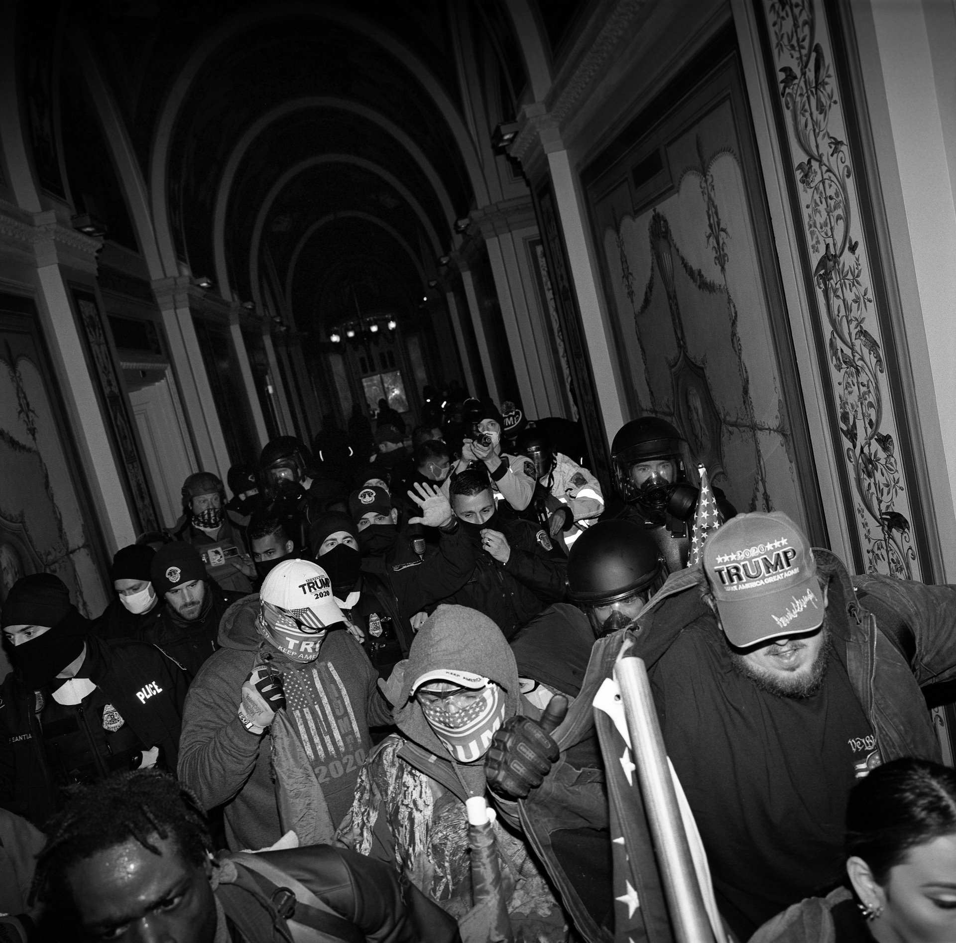 Pro-Trump supporters invade a Capitol hallway, after the building had been breached during a protest to overturn Joe Biden&rsquo;s electoral victory, in Washington DC, USA. The Capitol complex was locked down, and elected officials, including Vice-President Mike Pence, were hastily evacuated.