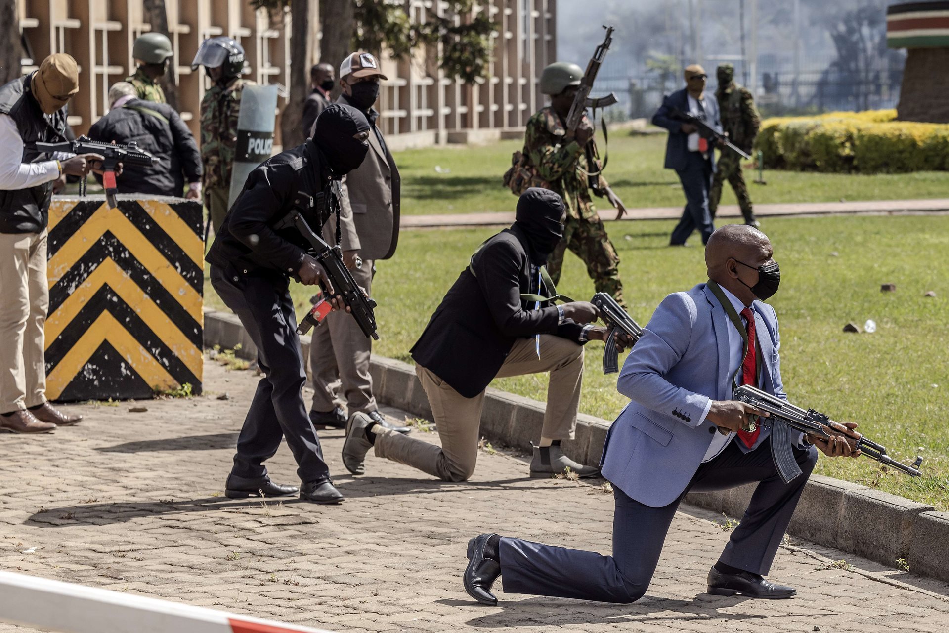 Kenyan police officers and security personnel protect the Kenyan Parliament against protesters attempting to storm the building. Reports that police fired live ammunition at demonstrators led to condemnation by human rights groups and other countries calling for investigations and police reform in Nairobi, Kenya.