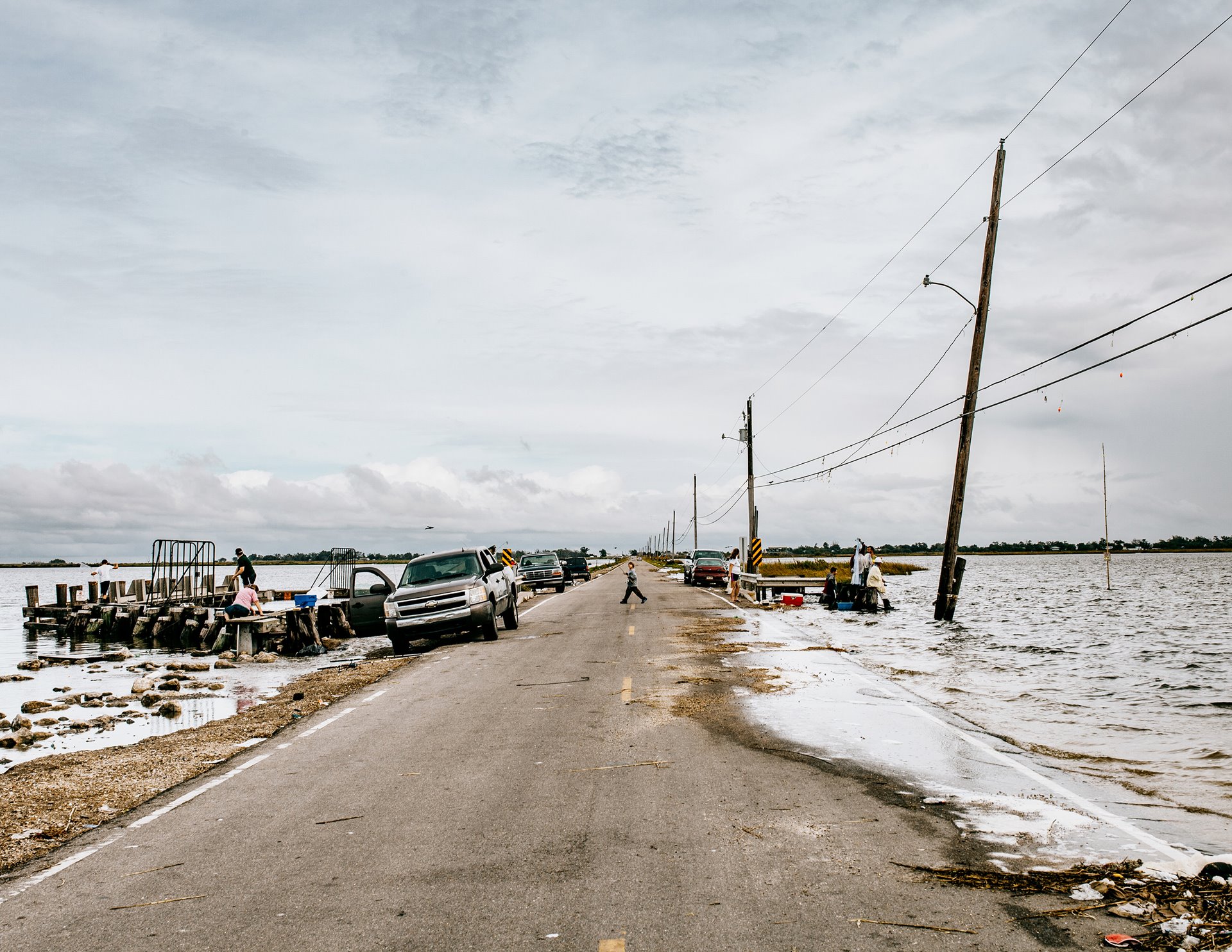 Island Road is the only thoroughfare connecting Isle de Jean-Charles to the mainland. It becomes inundated by water during high tides. During hurricanes, it may be entirely submerged. Federal funds are no longer available for road repairs because of the small number of residents on the island. Isle de Jean-Charles, Louisiana, United States.