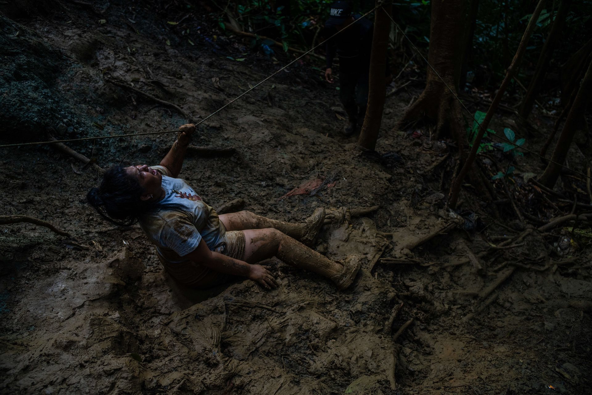 Yhoana Sierra screams after falling on a muddy slope. Pregnant at the time, she woke up bleeding the following morning, likely having lost her baby.