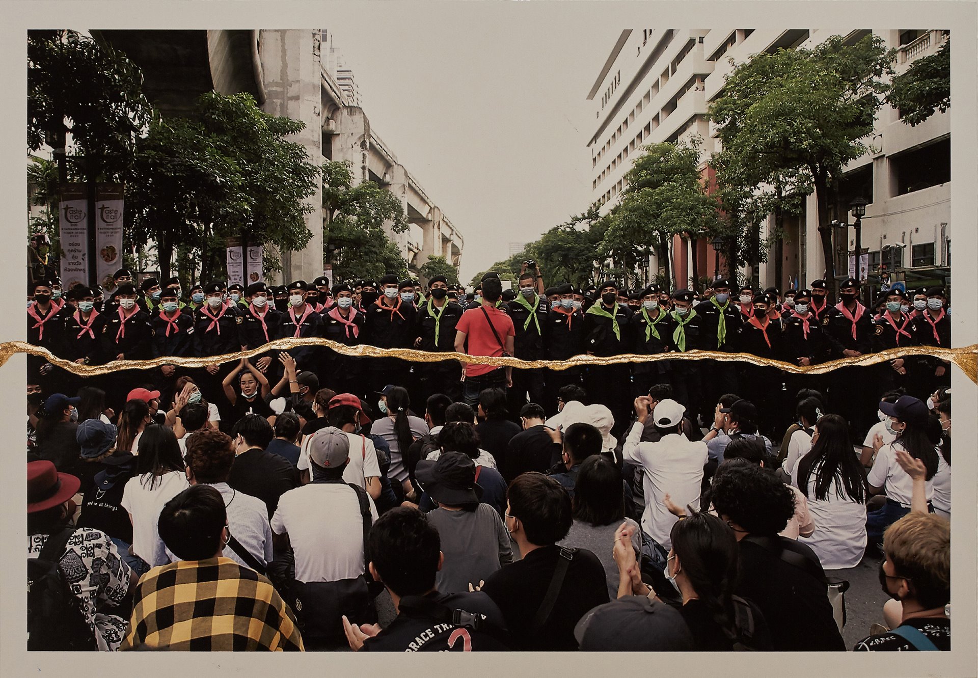 <p>A protest in Bangkok, Thailand. When confronting the police, Thai pro-democracy protesters have adopted the tactic of sitting down to express peace and solidarity.</p>
