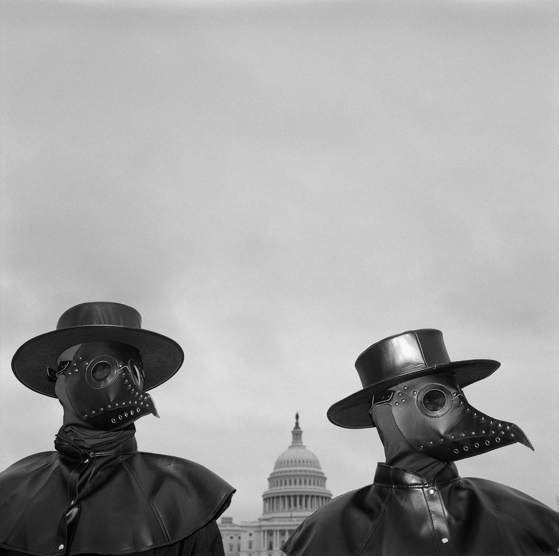 Pro-vaccination activists wearing beaked masks similar to those worn by 17th-century doctors in times of plague seek to draw attention of spectators around Capitol Hill to the message that refusing to be vaccinated will prolong the COVID-19 pandemic. That day, two government subcommittees held a joint hearing on disinformation in social media.