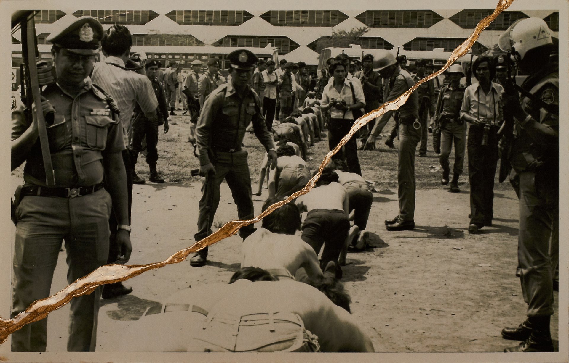 Protesters kneel in a row in front of government forces at Thammasat University, Bangkok, Thailand. The photographer tears the images as an imitation of hate and violence and then mends the breaks with gold to emulate hope for the future.