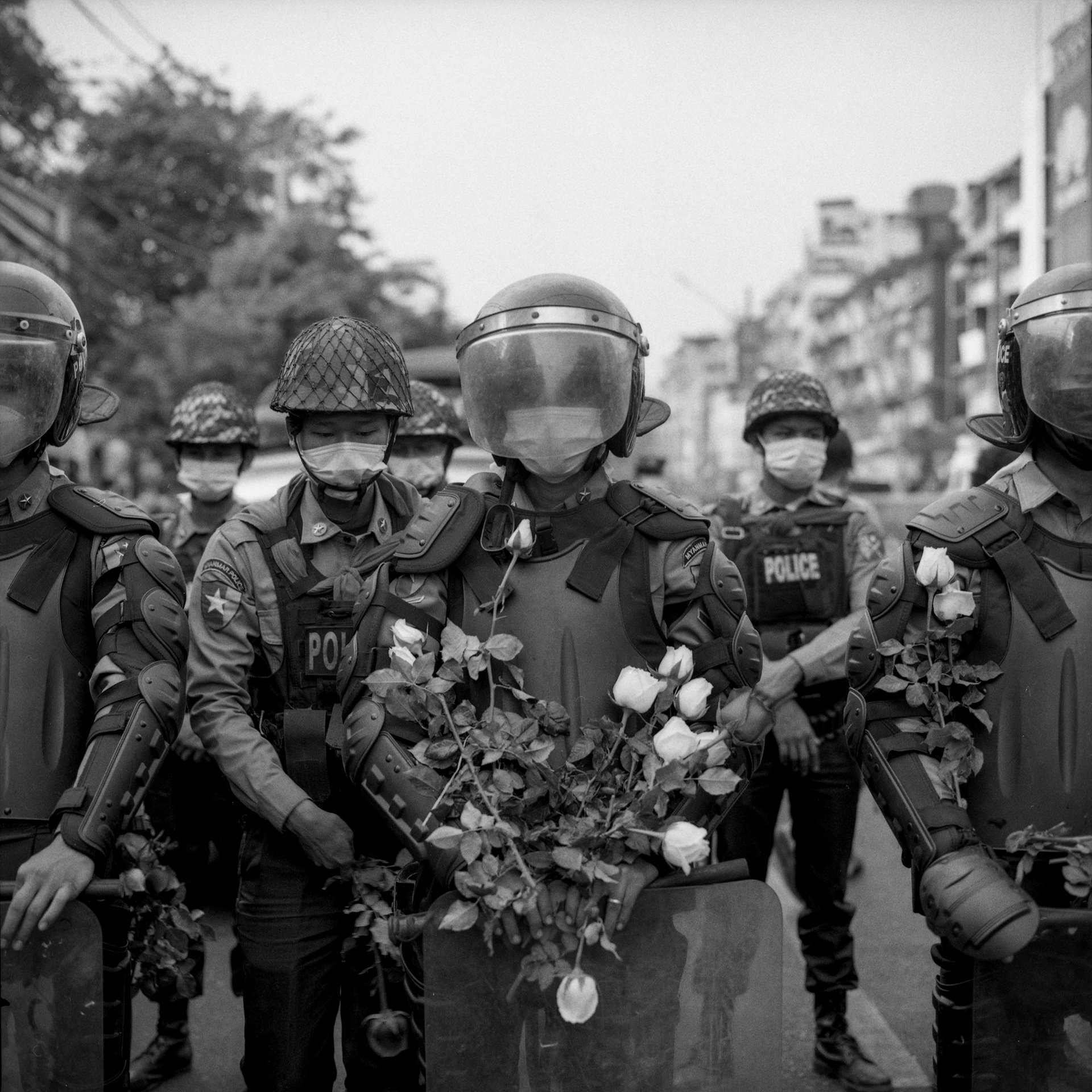 Anti-coup protesters handed flowers to riot police saying, &ldquo;you are the people&rsquo;s police,&rdquo; in Yangon, Myanmar.&nbsp;