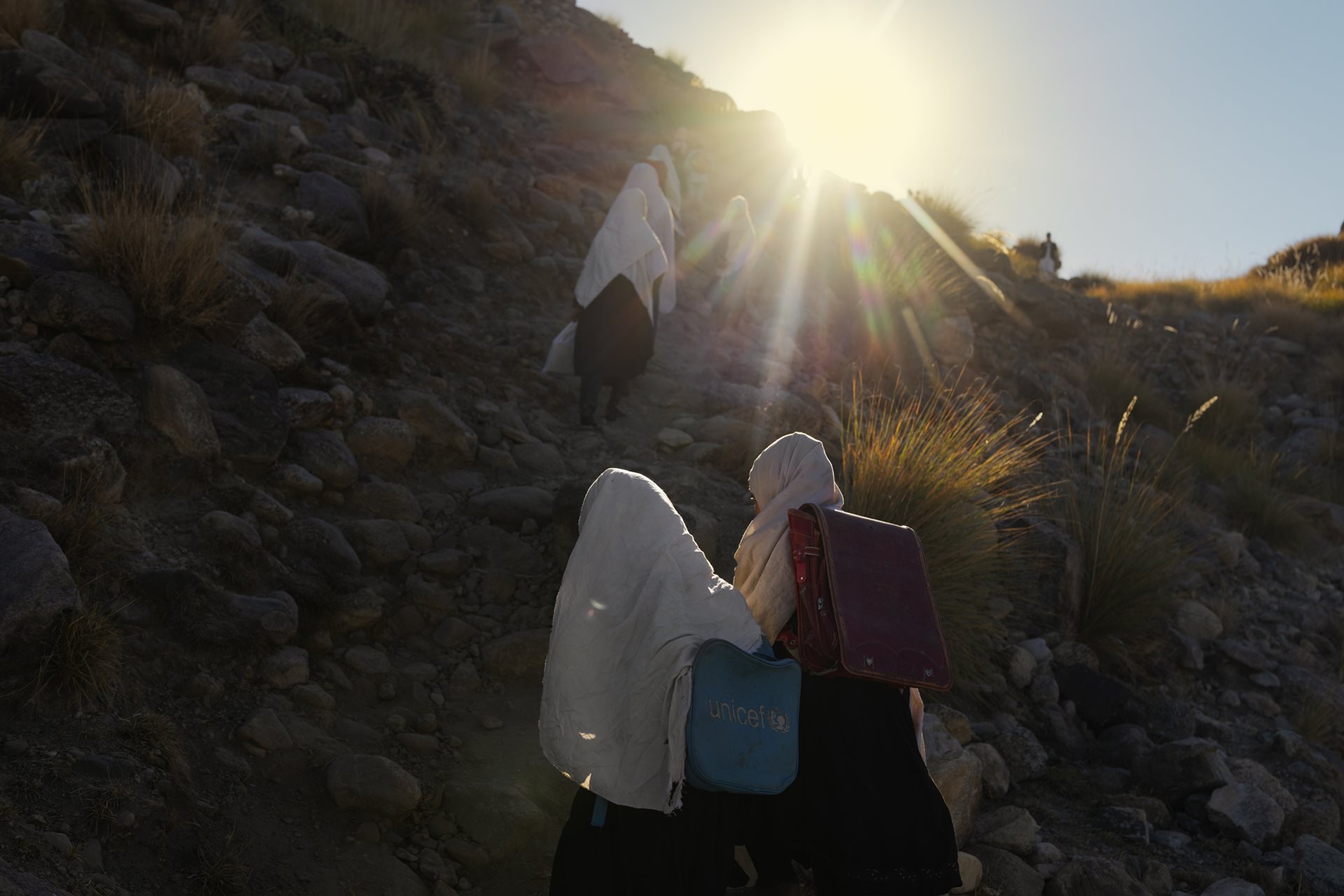 Students walk to Miadad Primary School in Khartanai Village, Haska Meyna District, Afghanistan. Hundreds of children across Afghanistan travel long distances on foot to attend classes.&nbsp;