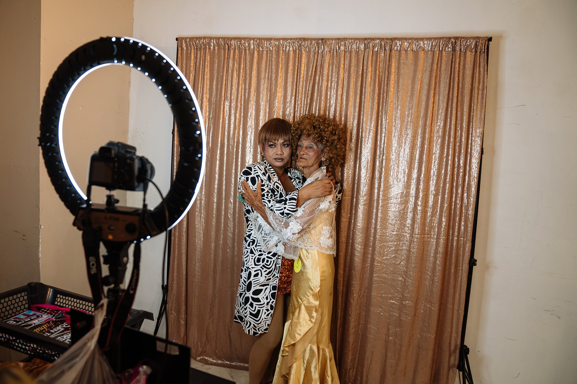 Al Enriquez (86) and Zoraida Sanchez pose in a photo booth during a show in Manila, the Philippines.