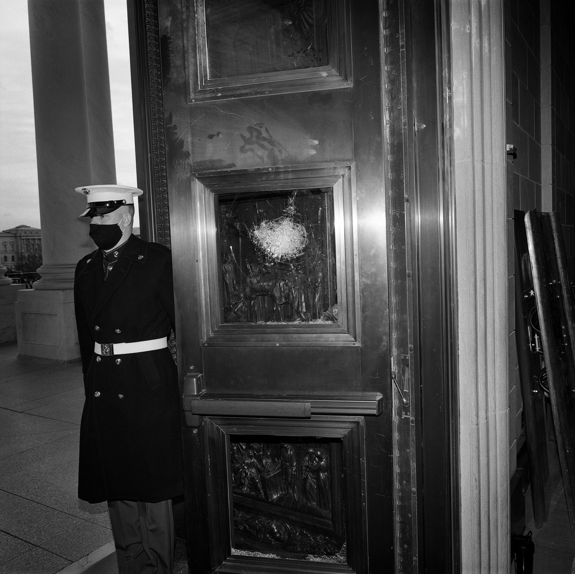 A US Marine from the White House practices opening doors at the Capitol Building, in Washington DC, USA, on 19 January 2021, the day before the inauguration of Joe Biden as president and Kamala Harris as vice-president. This was one of several doors damaged when protesters breached the Capitol Building in an attempt to stop the certification of the 2020 presidential election.