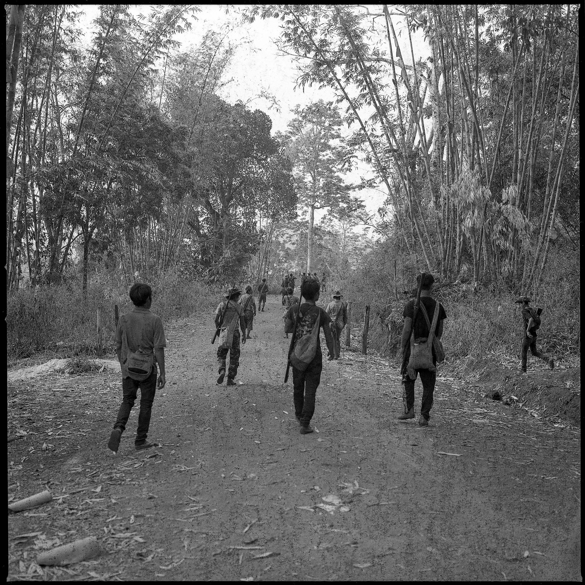 Villagers carrying homemade hunting rifles return from tactical training in Hpruso township, Kayah (Karenni) State, Myanmar. Around the country, citizens had joined People&rsquo;s Defense Forces in armed opposition to military rule.