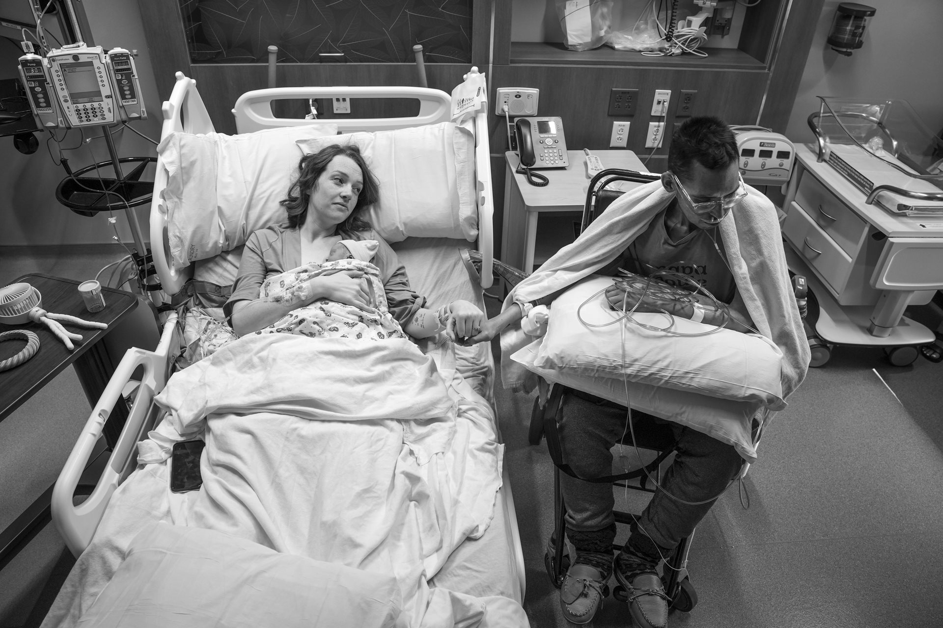 <p>Shay holds her newborn daughter, AmyLou. On the day of her birth, Tanner managed to stay at the hospital for over four hours &ndash; remarkable considering he could not stay awake for more than 30 minutes at a time in recent weeks. American Fork, Utah, United States</p>
