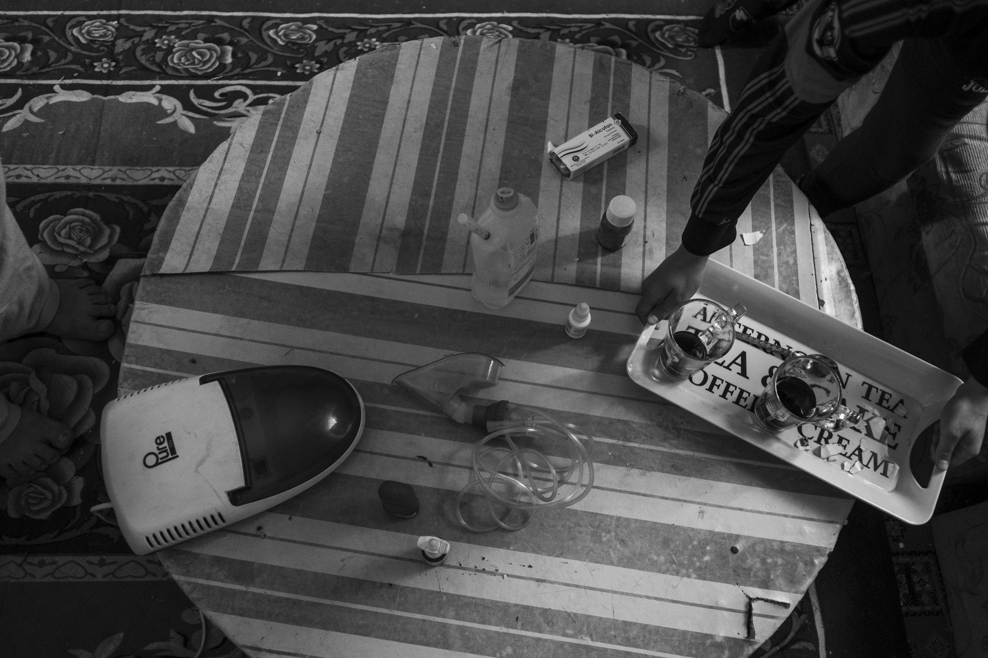 The breakfast table at Awady's apartment in Moon Valley, Alexandria, Egypt. Breathing ventilators and medication are part of everyday life.&nbsp;<br />
&nbsp;