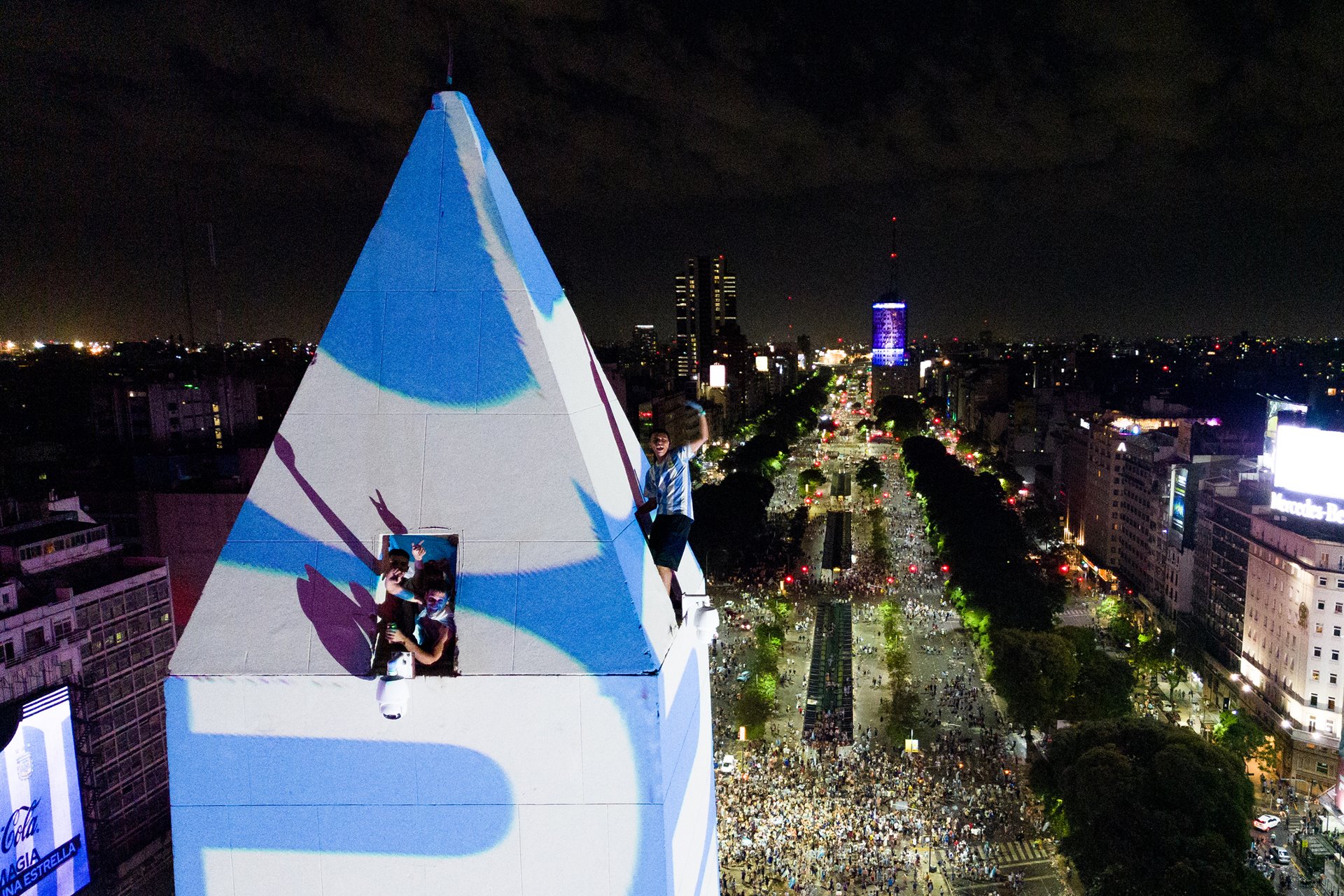 Fans celebrate Argentina&rsquo;s victory on top of the Obelisco de Buenos Aires, a national historical monument located in the Argentinian capital&rsquo;s main square.&nbsp;
