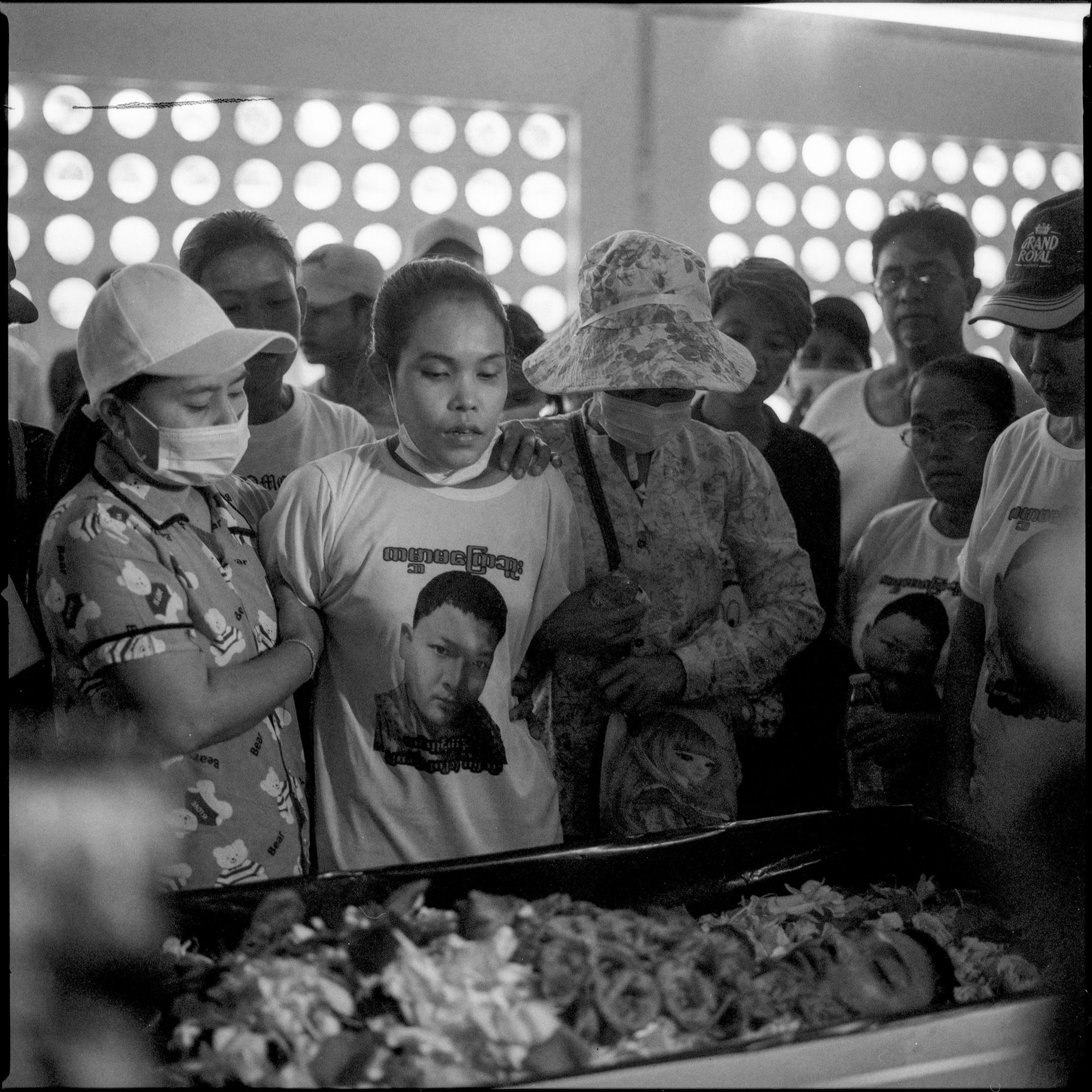 The wife of Tin Htut Hein mourns at his funeral service, on the outskirts of Yangon, Myanmar. Unknown gunmen shot him during his night shift with a community-founded vigilante security team.&nbsp;