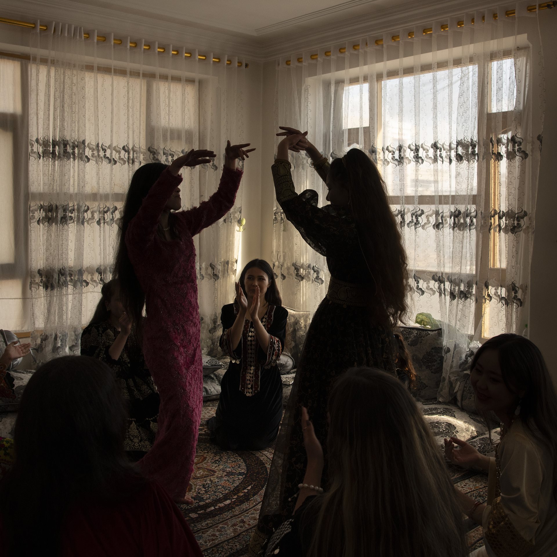 Young women celebrate a friend&rsquo;s birthday, in Kabul, Afghanistan. The Taliban have forbidden music and dancing, but women continue to dance and celebrate in private.