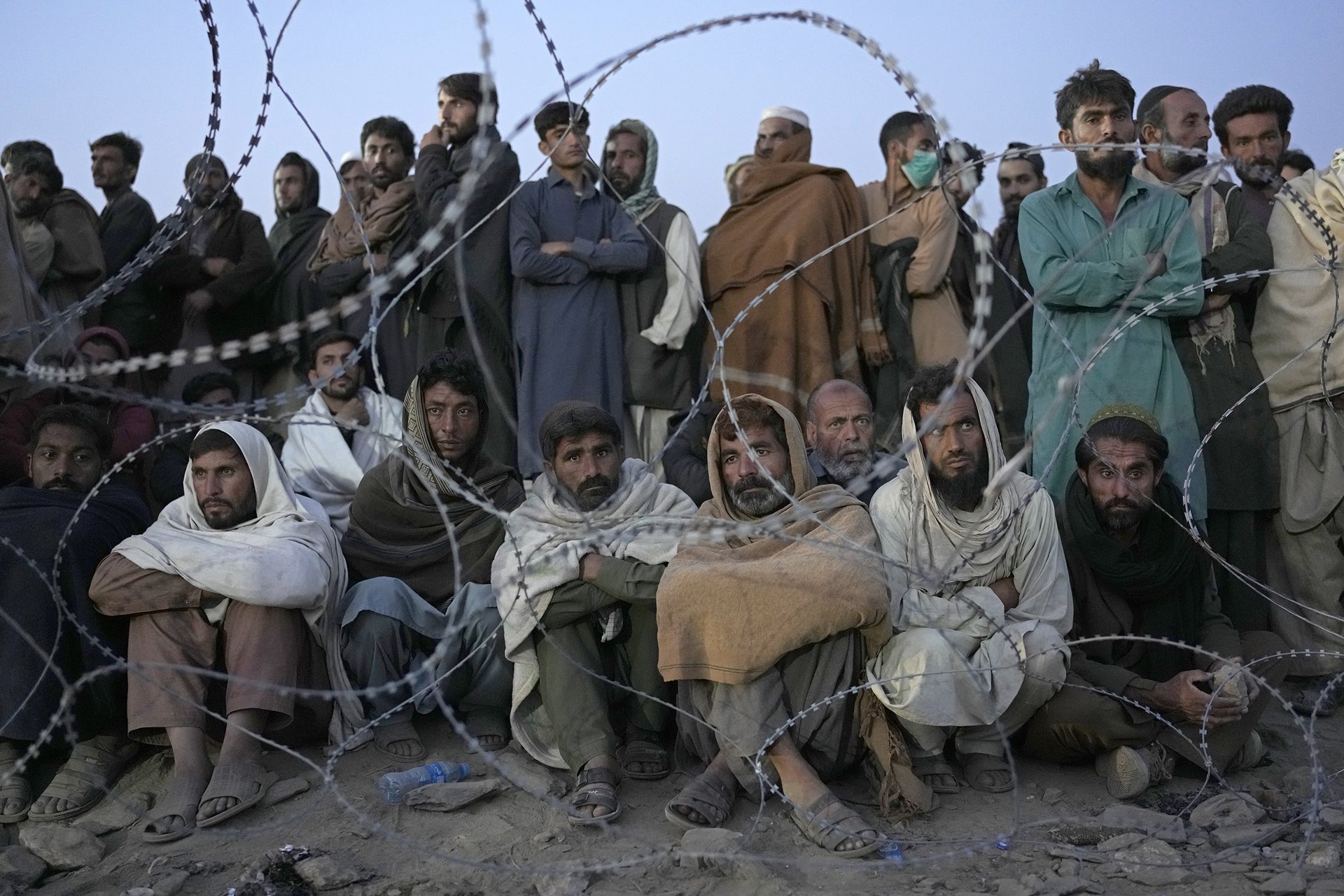 People wait to register in a refugee camp in Torkham, Afghanistan, near the main border crossing from Pakistan into Afghanistan, days after the Pakistan government&rsquo;s 1 November deadline for the deportation of undocumented Afghans.