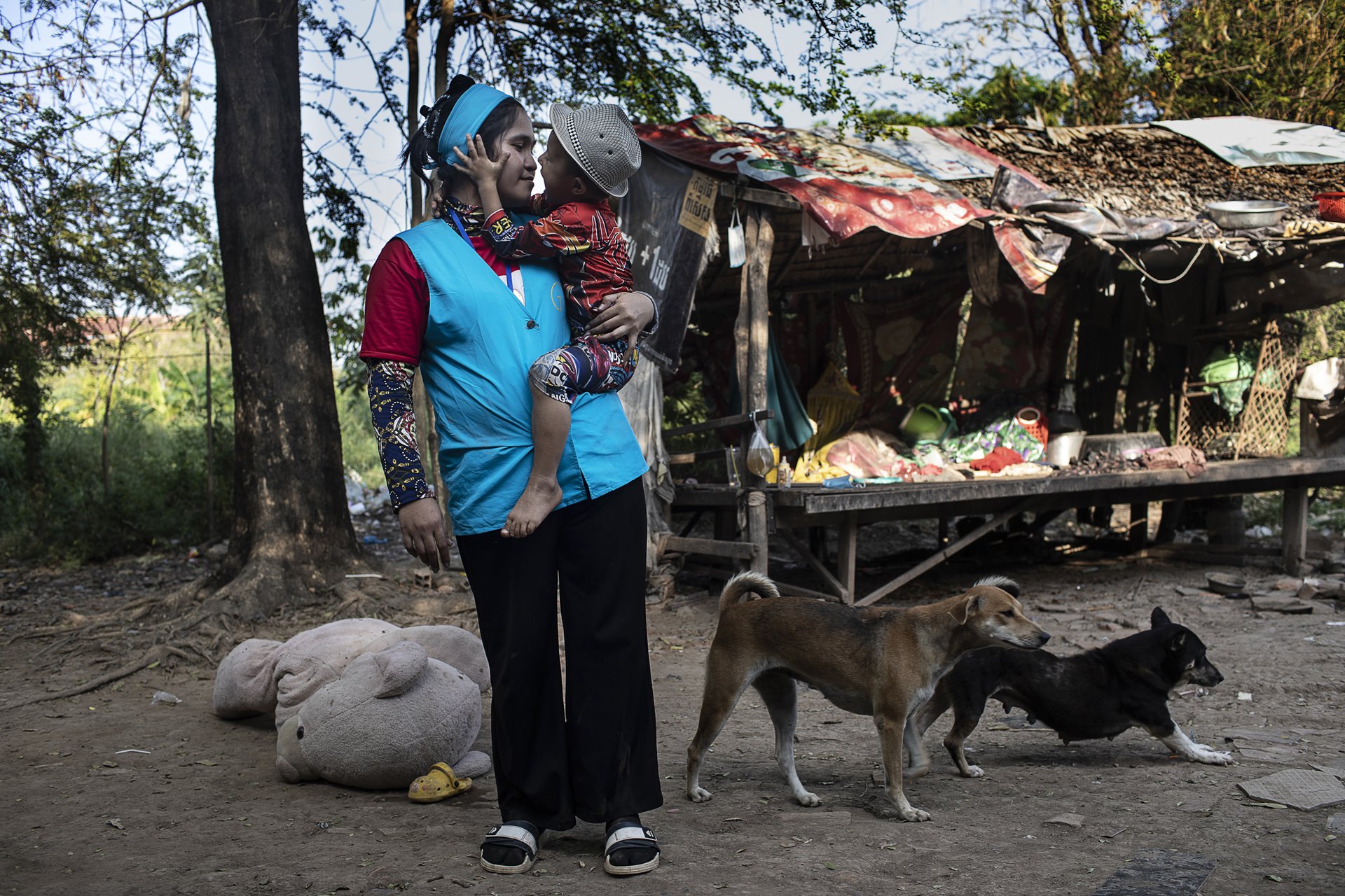 <p>Hun Daneth and her son from surrogacy, Siyeahoeung China, embrace after her long day at work in Phnom Penh, Cambodia. Siyeahoeung&rsquo;s biological father, Xu Wenjun, is in prison in Cambodia on human trafficking charges. He was arrested in Cambodia while trying to establish a relationship with his son from surrogacy and lay the legal groundwork necessary to bring him back to China.&nbsp;</p>

