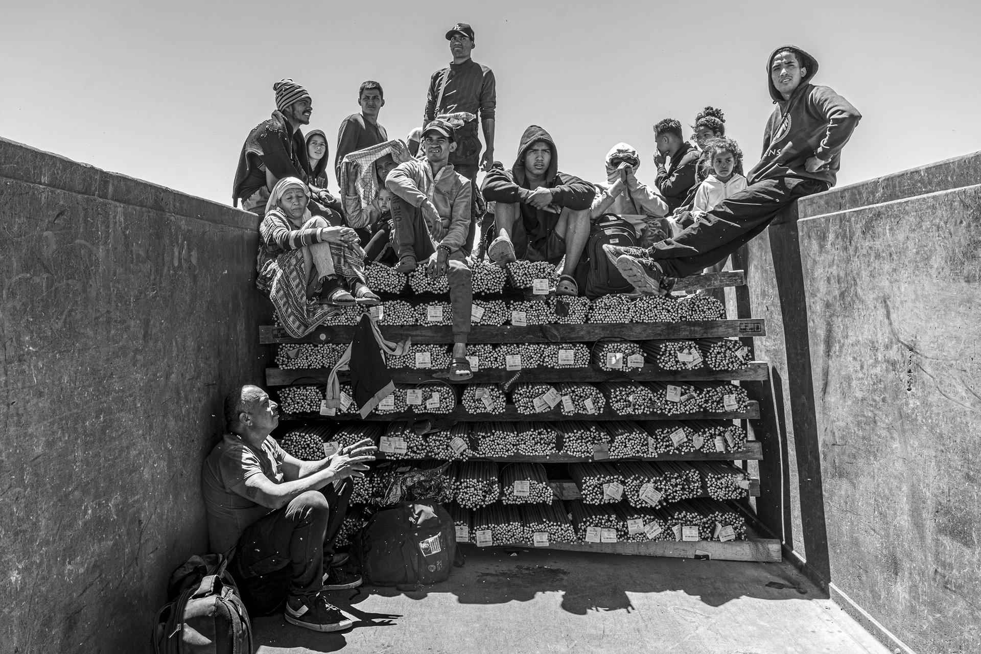 The De Coto family poses for a portrait aboard &ldquo;The Beast&rdquo; while heading to Ciudad Juárez. This photo was taken in Samalayuca, Mexico, three days before the expiration of Title 42, a US COVD-19 prevention measure that in effect allowed deportation of migrants without reviewing asylum claims. Since 2020, there have been over two million expulsions of migrants by US Customs and Border Protection under Title 42.&nbsp;