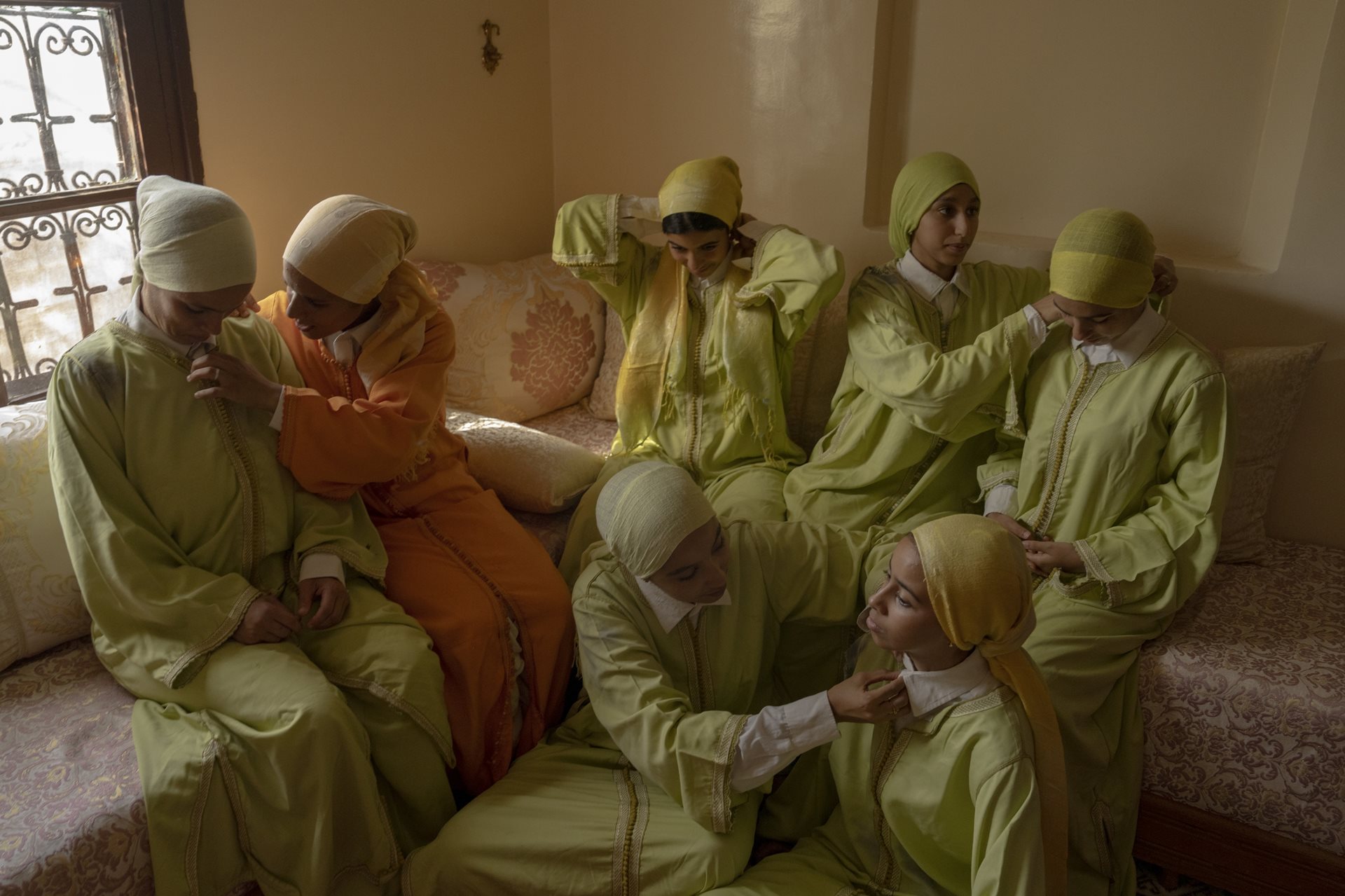 The troupe of Bouchra Nabata, one of the first women to take part in Tbourida in Morocco, dresses in traditional clothing in Rabat, Morocco.