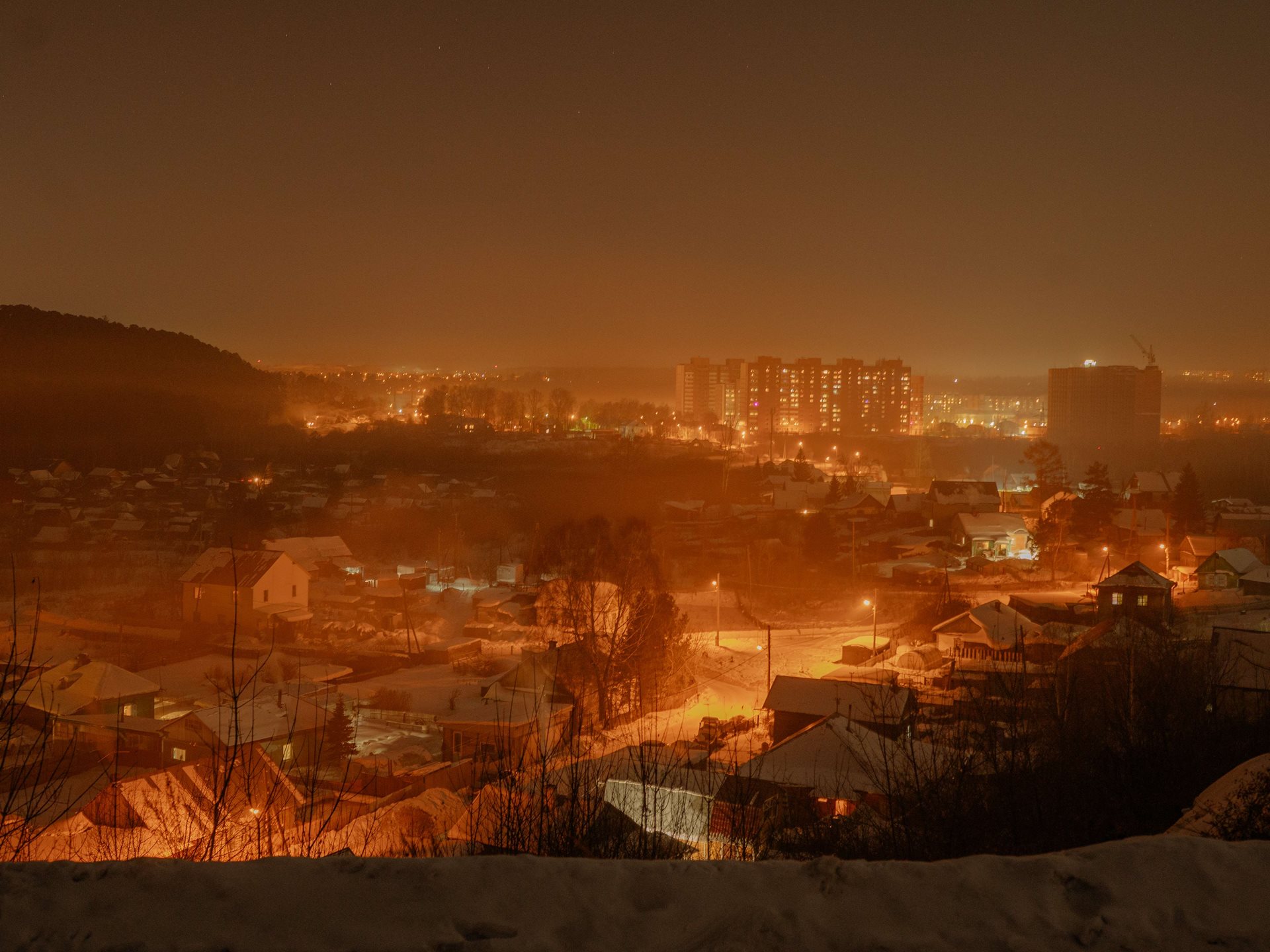 A view of the Stepanovka neighborhood of Tomsk, Russia. Stepanovka looks more like a village than an urban neighborhood, yet it takes just 30 minutes to get to the city center by bus. Aliona&rsquo;s parents bought a house there after they married; she was born there and lived there for 27 years.