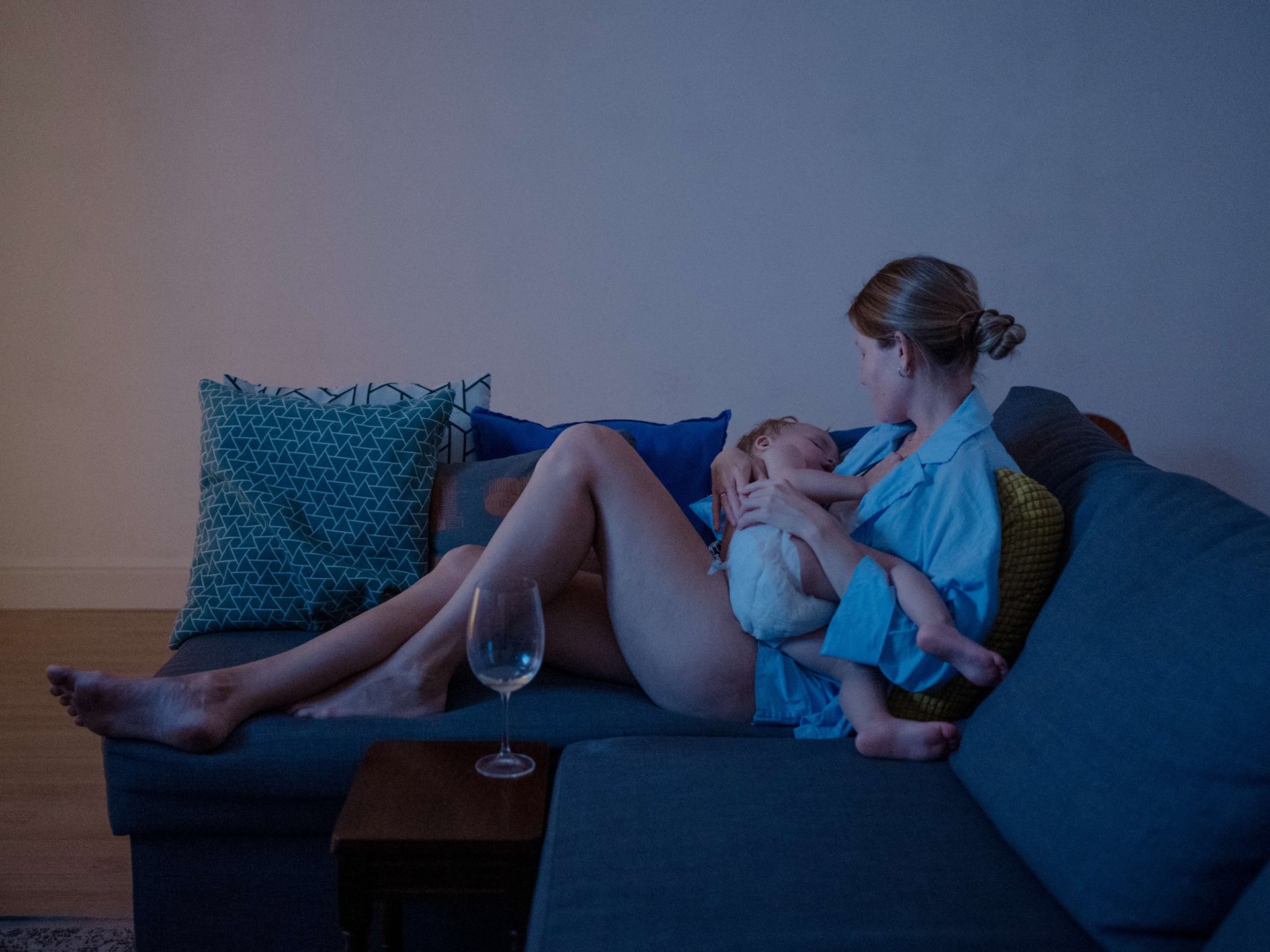 Tanya, a friend of the photographer, cradles her two-year-old son, in Tomsk, Russia. Most of their mutual friends left Russia after the government introduced conscription, but Tanya remains because her husband cannot leave, and she won&rsquo;t go without him.
