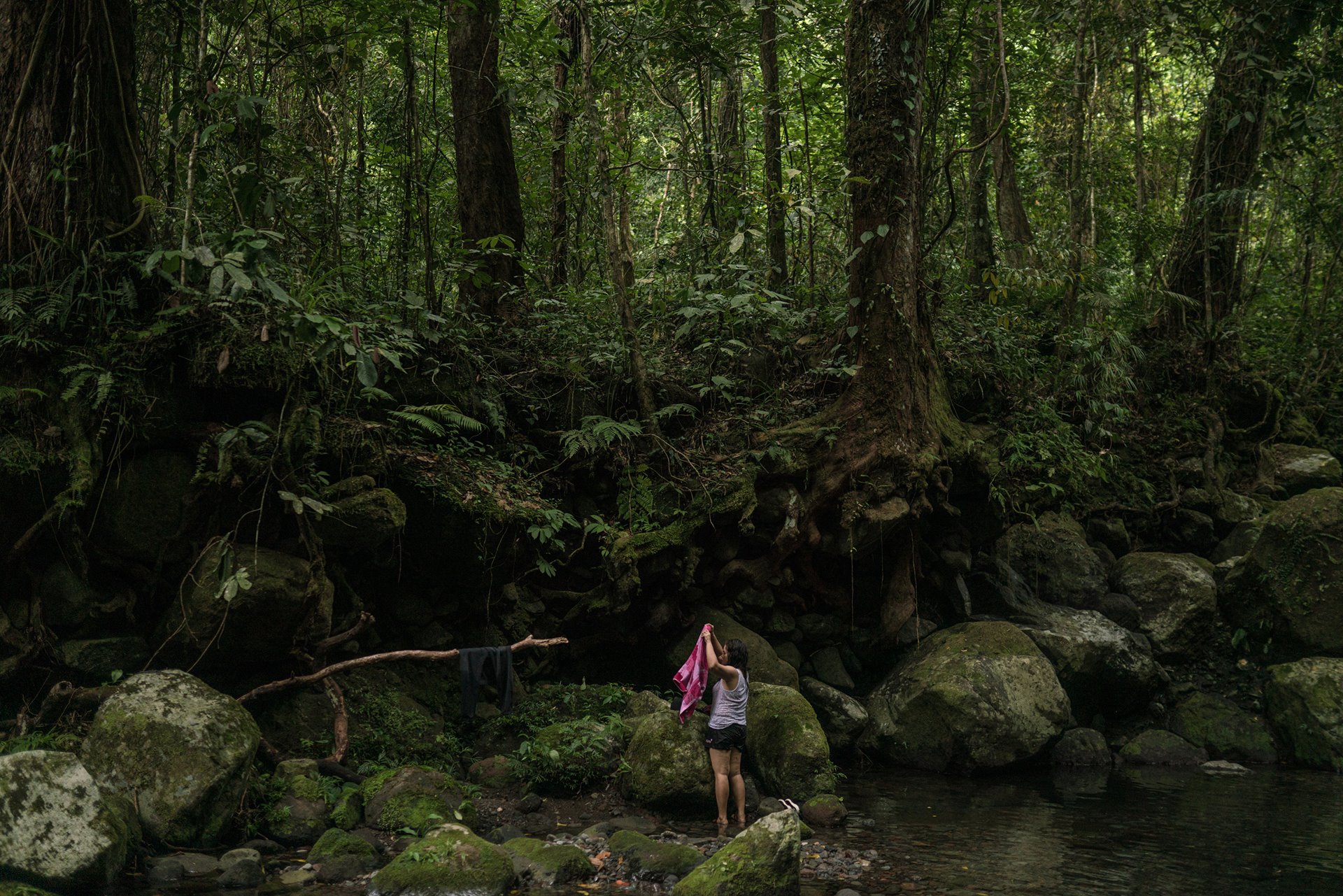 Marilyn Malimban dries a towel during a hike and camping trip in Mount Banahaw in Quezon Province, the Philippines. The trip was organized by Paghilom (Healing), a program started in 2016 by former drug user Father Flaviano Villanueva for families of victims of the war on drugs, providing them with support and counseling. Marilyn filed a charge against the police and their informants, after her partner Jessie Cule was killed during an alleged anti-drug operation. She is one of the few people to take such action. The court case remains pending.&nbsp;