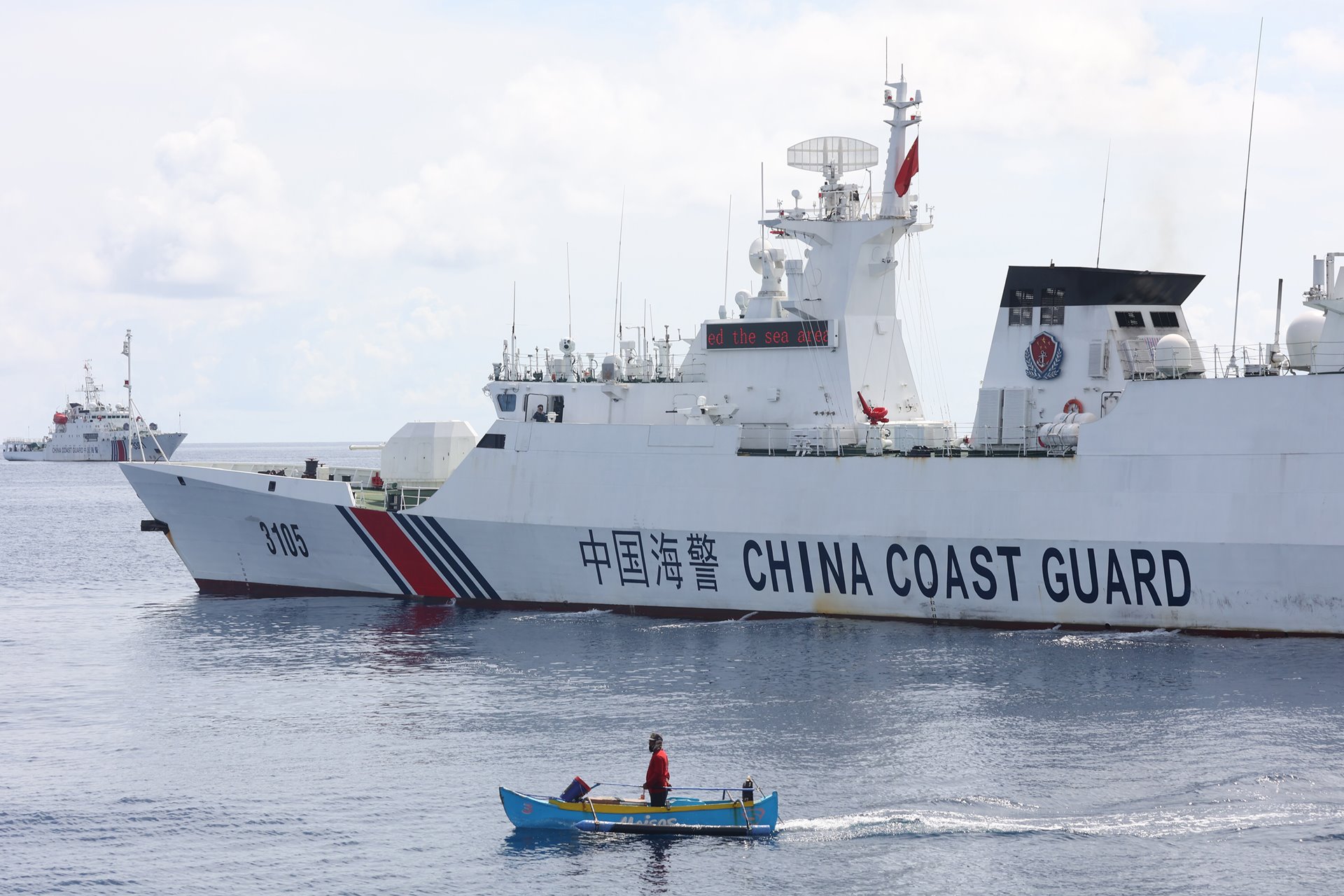 Arnel Satam (54), a fisherman, stands in his tiny wooden boat after being chased by the China Coast Guard in his attempt to enter the lagoon of Scarborough Shoal, off Zambales province, Philippines. Satam says that he has twice been hit by jets from water cannons, in past encounters with the China Coast Guard.<br />
&nbsp;