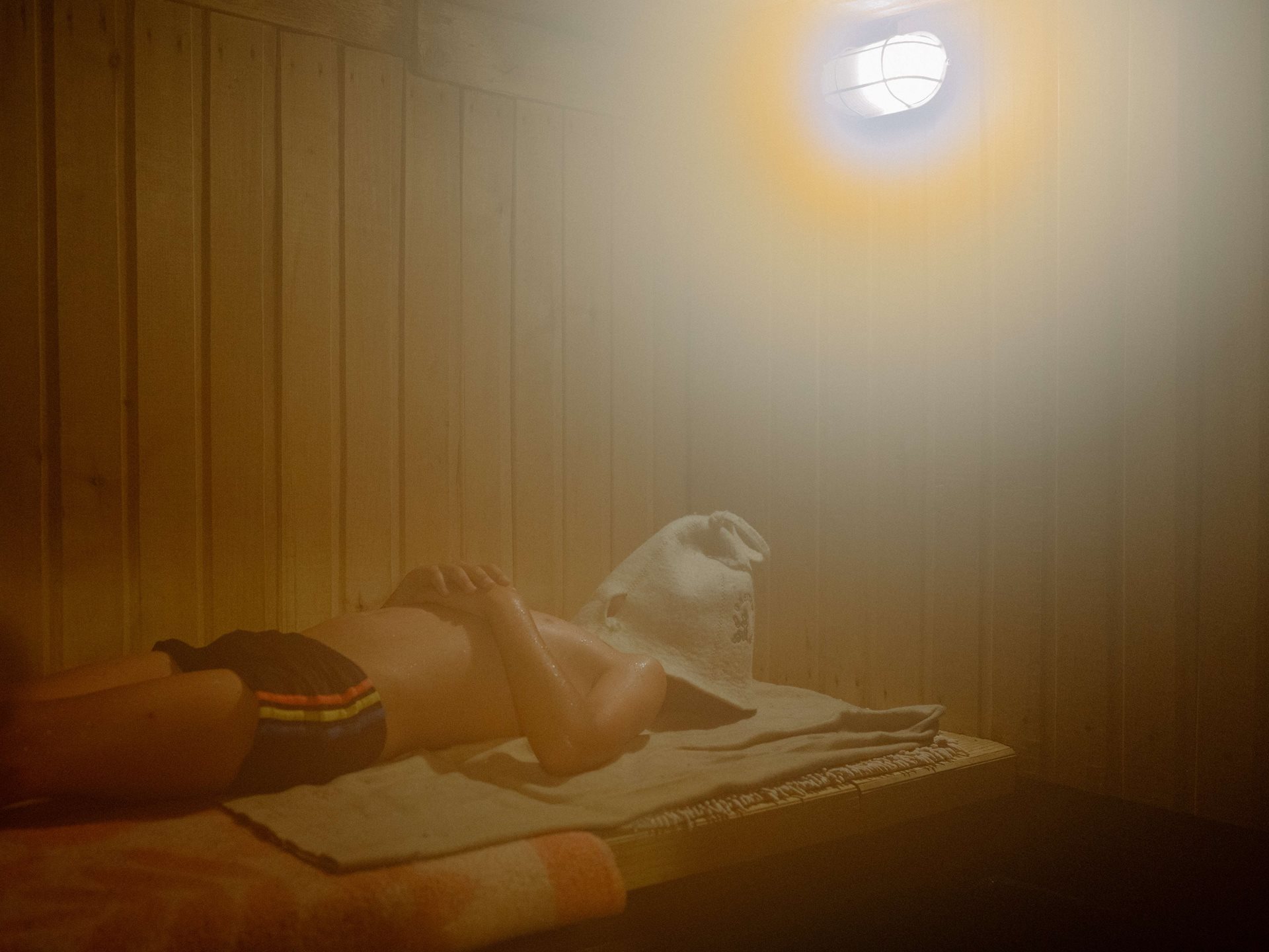 Aliona&rsquo;s nephew Yarik in the family banya (wet-steam sauna) in Tomsk, Russia. The experience and rituals of the banya are among Aliona&rsquo;s most vivid associations with home: &ldquo;The fogged window, the smell of birch brooms and the fir oil that my dad pours on the hot stones, hot tea with currant leaves, dusk, a few mosquitoes, and steam enveloping me in the cool August air.&rdquo;
