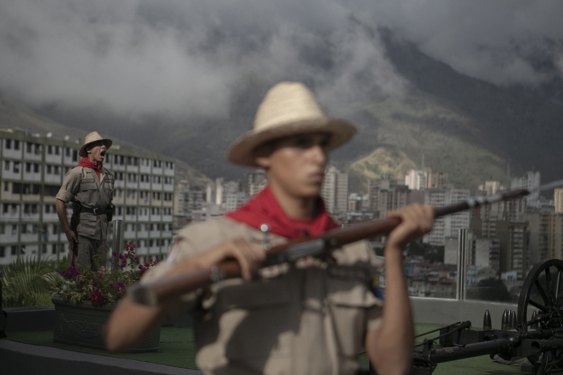 <p>Members of the civilian Bolivarian Militia of Venezuela commemorate the fourth anniversary of President Hugo Chávez&rsquo;s death, in Cuartel de la Montaña, Caracas, where his body rests.&nbsp;<br />
<br />
When Chávez was first elected in 1998, his socialist and populist economic and social policies were funded by high oil prices. He began a program of nationalization of energy and telecommunications companies and redistribution of wealth, alongside an anti-US foreign policy, but by the time of his death from cancer in 2013, oil prices and the Venezuelan economy were beginning to falter.</p>
