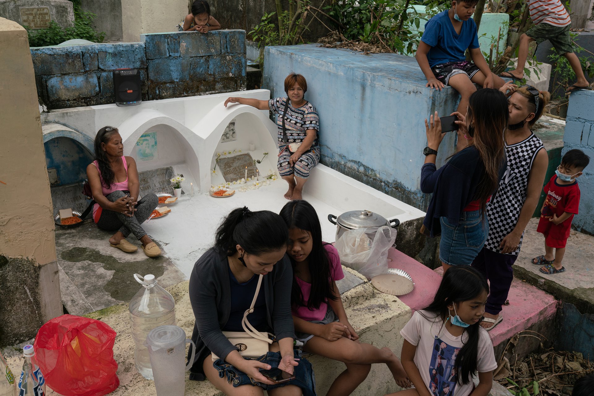 Isabelita Espinosa (seated to left of graves), Emily Soriano (seated to right) and their families commemorate the fifth anniversary of the death of their sons Sonny and Angelito, in Bagong Silang &ndash; Tala Cemetery in Caloocan, the Philippines. Living in the same neighborhood and close in age, Isabelita and Emily&rsquo;s sons were friends and were killed together with five others for allegedly going to a drug den, in what became known as the &ldquo;Caloocan massacre&rdquo;. The mothers have been active with Rise Up for Life and for Rights, a justice-oriented network for families of war-on-drugs victims.&nbsp;