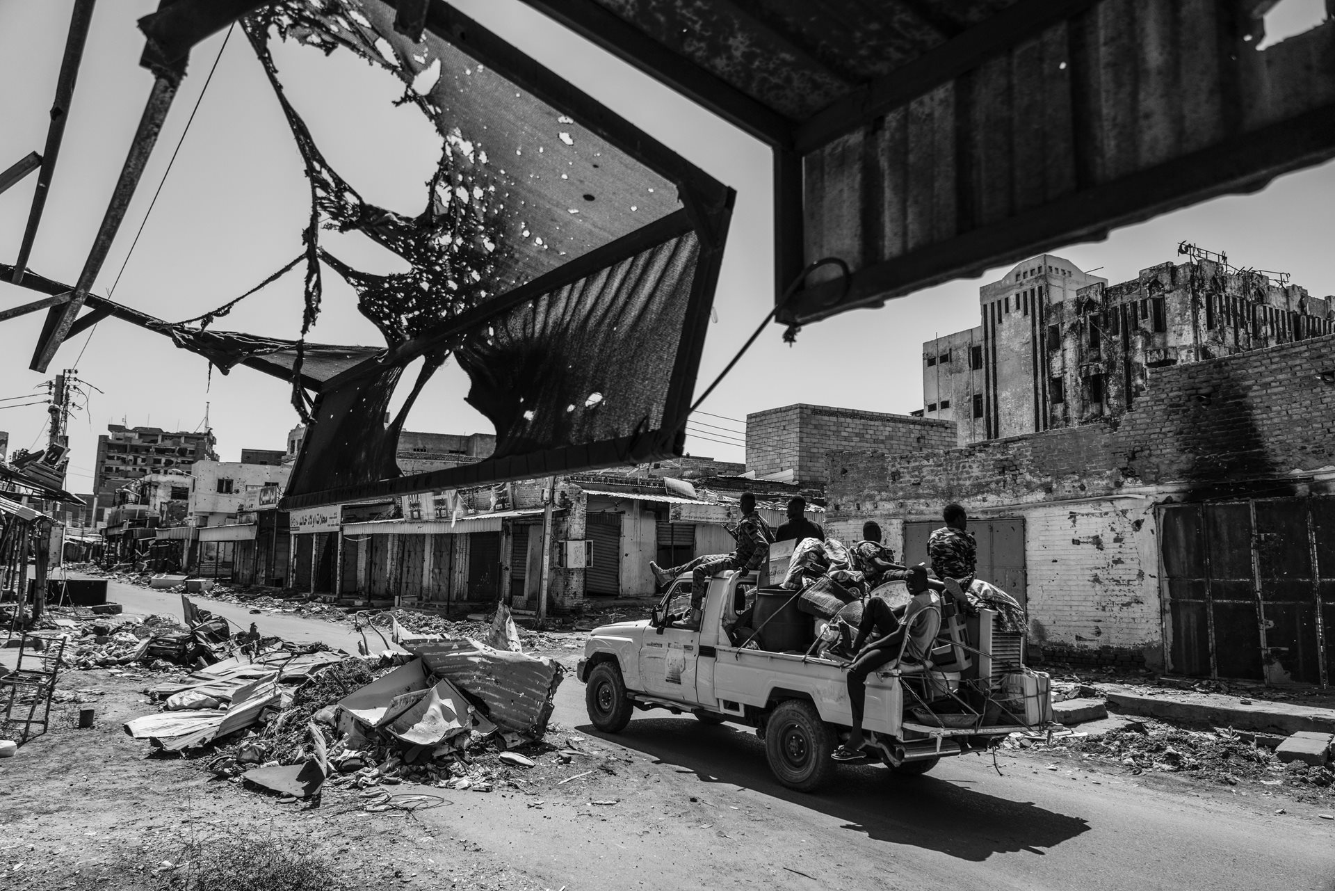 A group of soldiers passes through a damaged market in Omdurman, Sudan&rsquo;s second most populous city and a site of continuous fighting since April 2023.&nbsp;