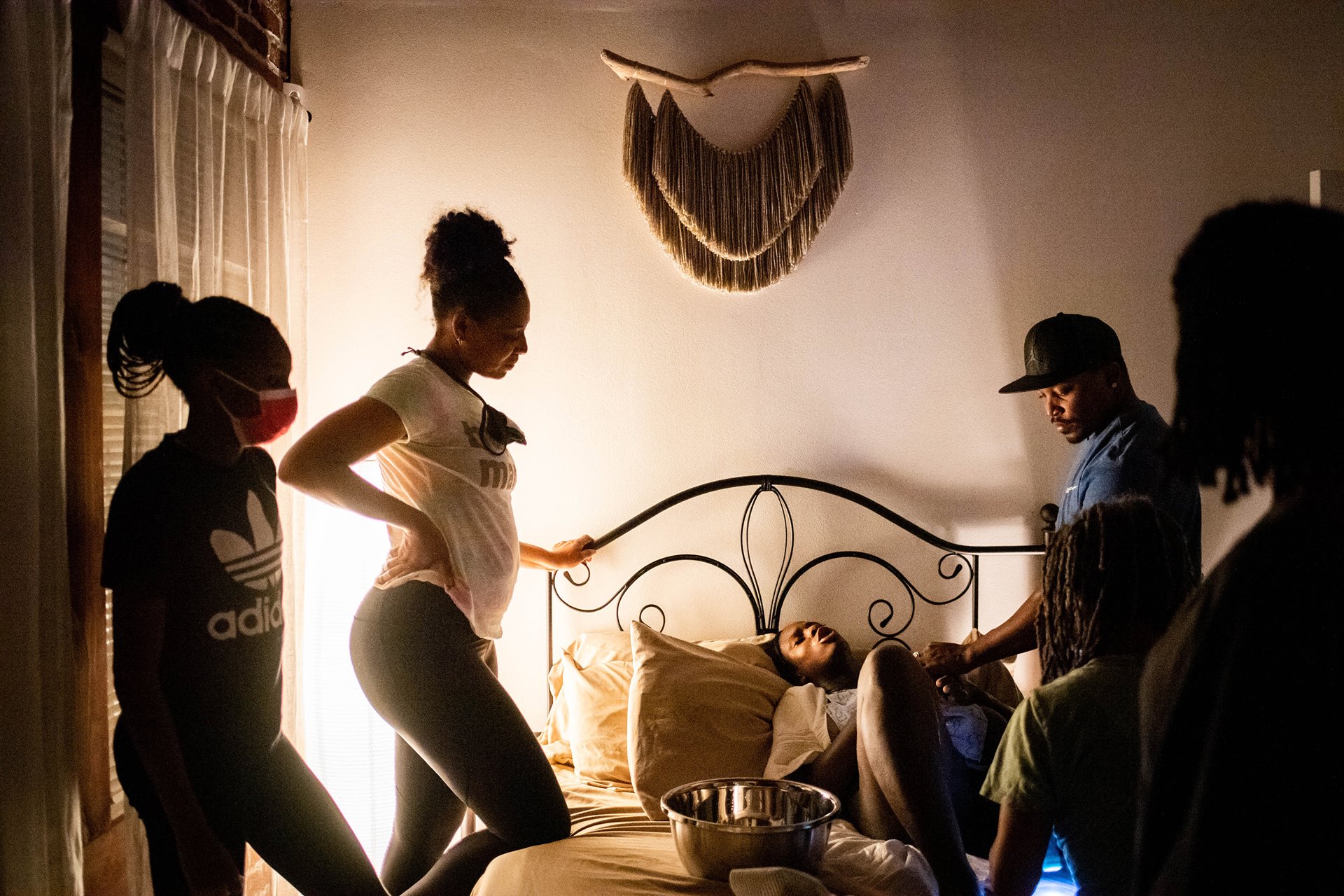 Aysha&rsquo;s sister Lauri Powell and her 13-year-old daughter Leena, together with Aysha&rsquo;s partner Dennis, watch over her after she has given birth.