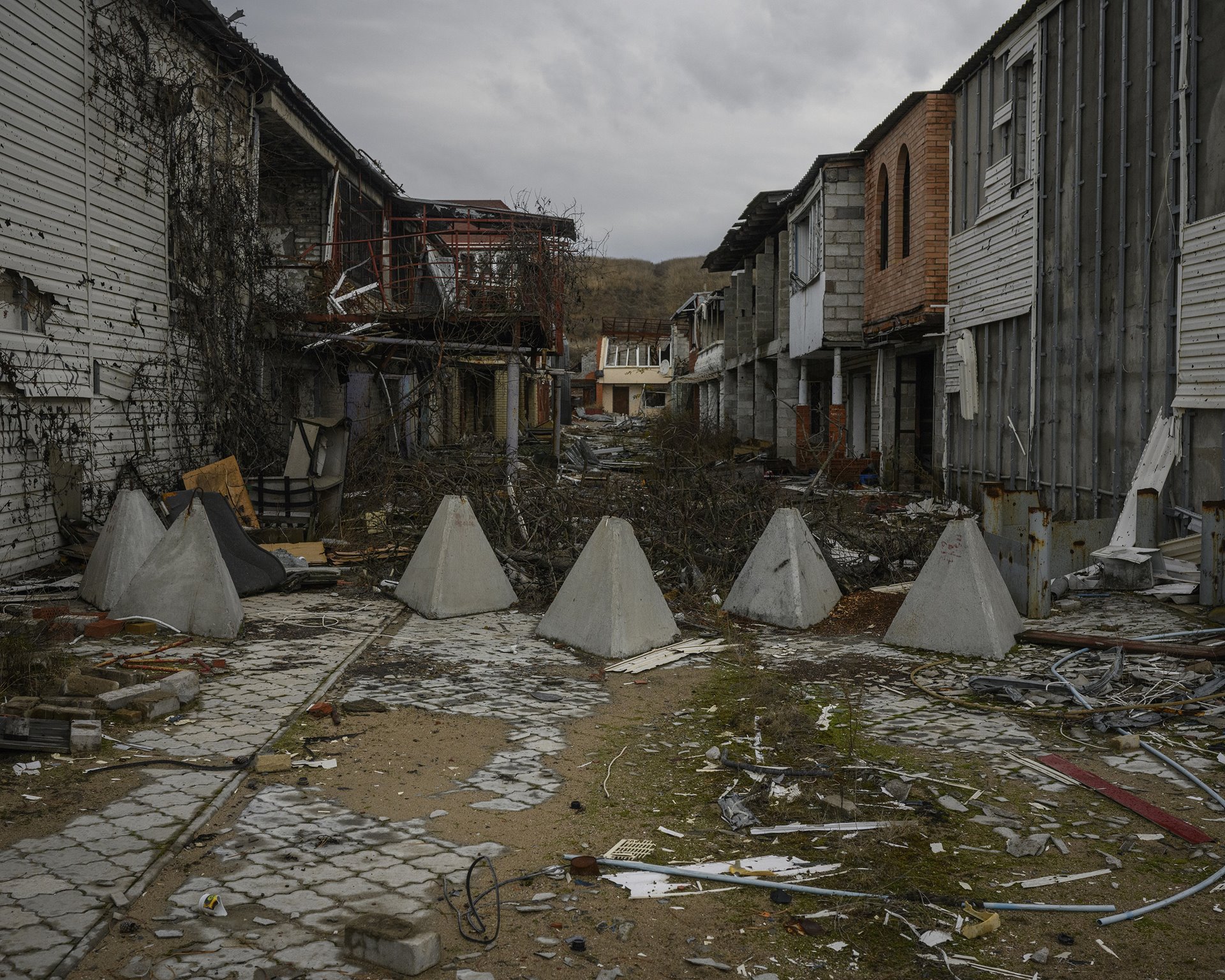 Fortification bollards lie across a street in Shyrokyne, Donetsk, Ukraine. Once a popular holiday resort on the Sea of Azov, Shyrokyne became a battleground in the 2014&ndash;2015 conflict between separatists and Ukrainian forces.