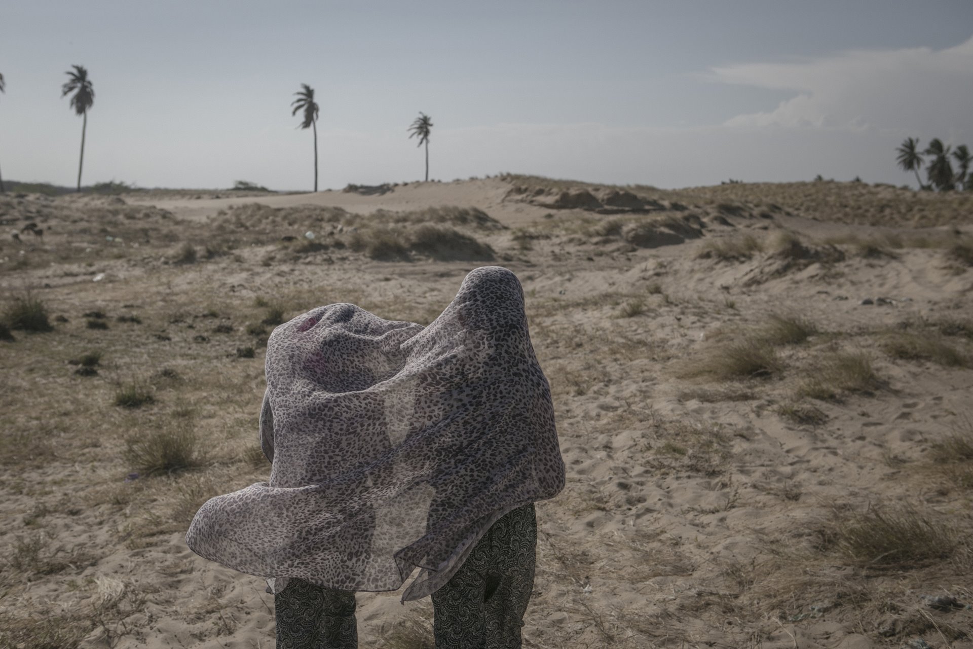 Two young women play with a scarf in the Guajira Desert, on the Venezuela-Colombia border.&nbsp;