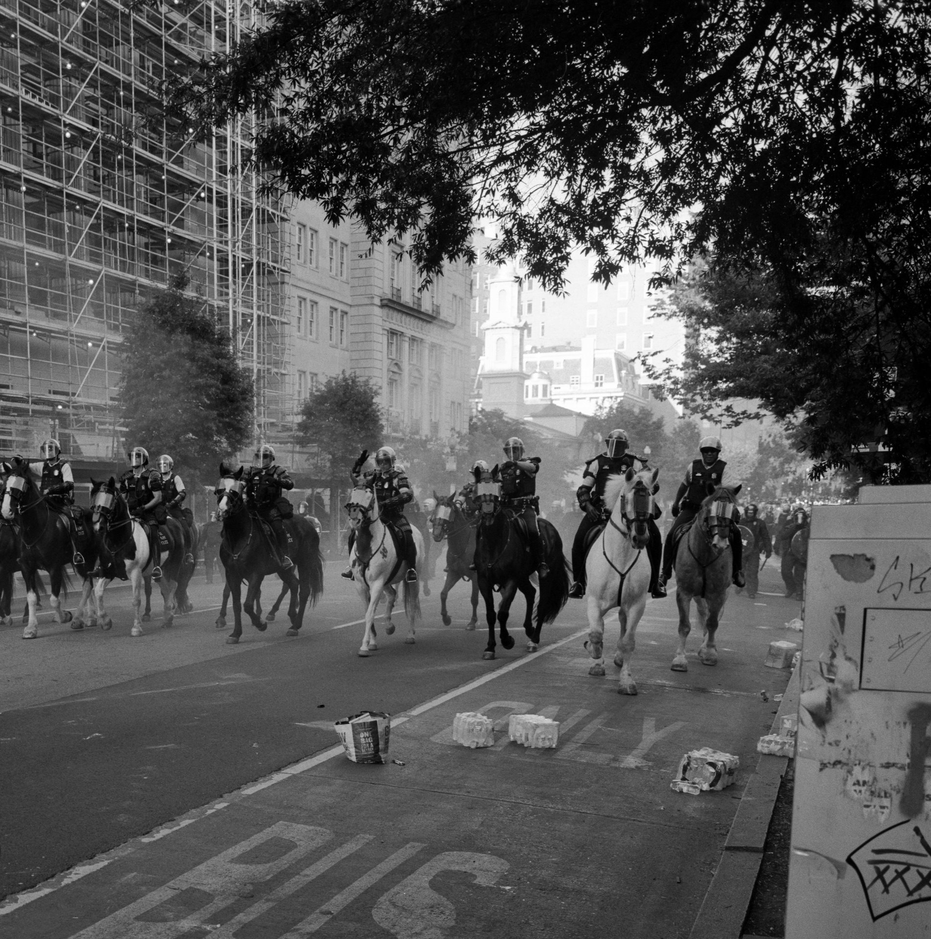 Mounted riot police clear mostly peaceful protesters from H Street near Lafayette Park, Washington DC, USA, before President Trump walked across the road to St. John&rsquo;s Church for a photo opportunity. The historic building was damaged a day earlier in a fire set during protests over the death of George Floyd, a 46-year-old Black man who was killed by a police officer while being arrested in Minneapolis on 25 May 2020.