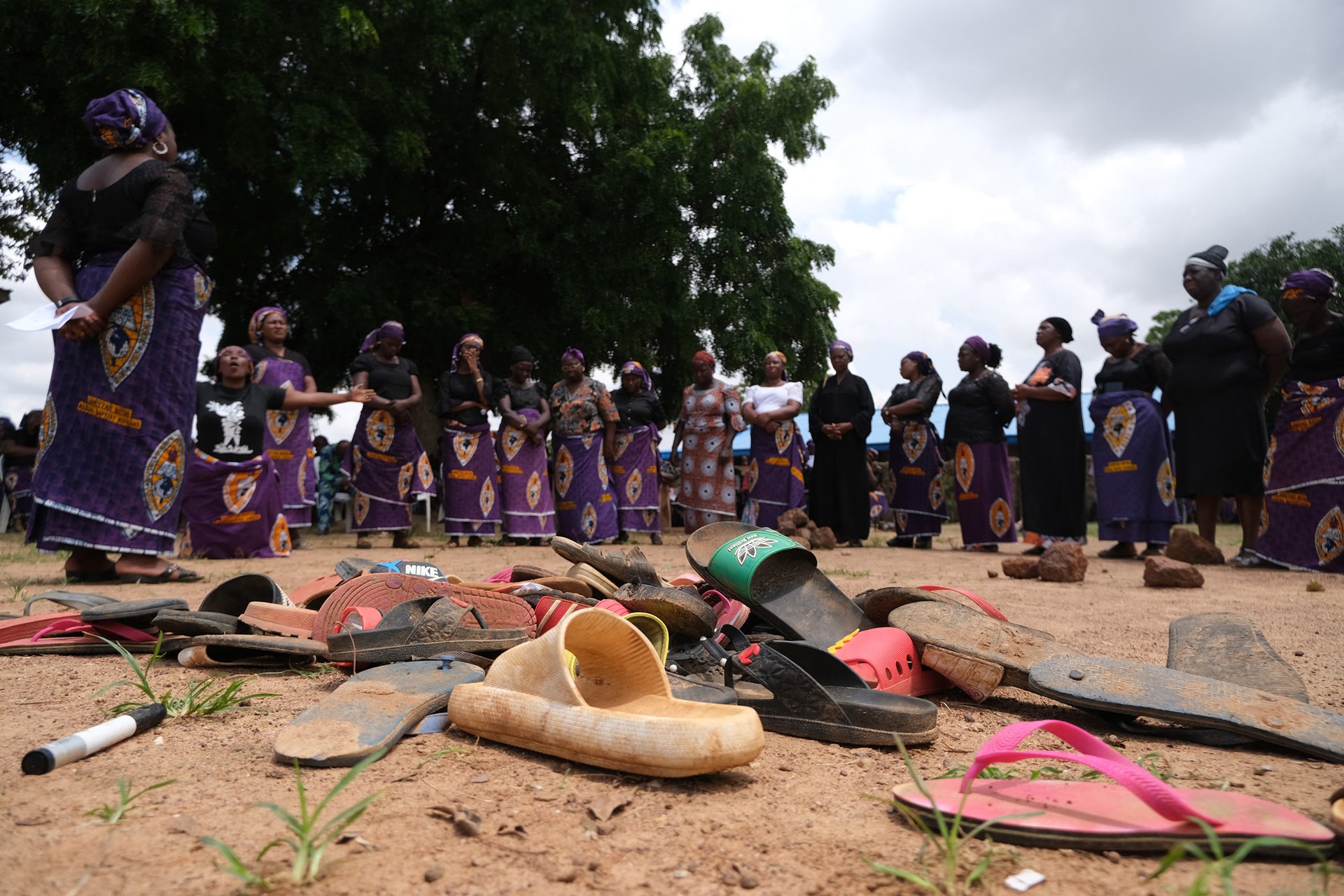 <p>Sandals belonging to kidnapped students remain lying on the ground at the Bethel Baptist High School, in Chikun, Kaduna State, northwest Nigeria. On 5 July, gunmen had abducted 140 children from the school.</p>
