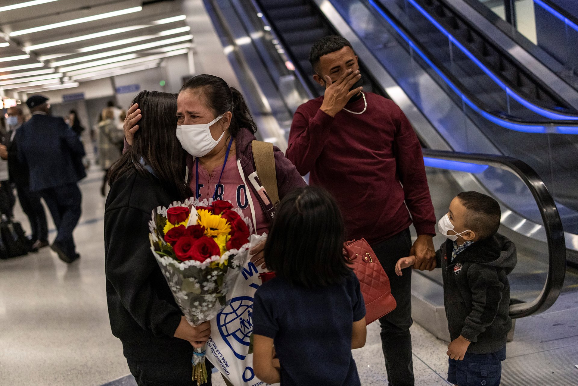 <p>Maria Hernandez hugs her daughter Michelle (referred to by her middle name to protect privacy), while her younger daughter Nicole looks on and son Maynor is overcome with emotion, during their family reunion at Los Angeles International Airport, California, United States.</p>
