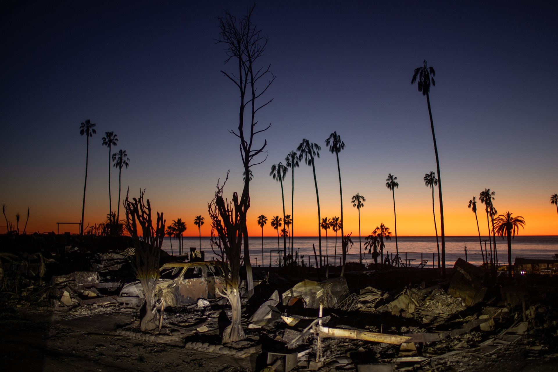 <p>The devastation of the Palisades Fire is visible at sunset. Experts emphasize that the extended, drier fire seasons in Southern California are exacerbated by human-caused global warming trends. Los Angeles, California, United States</p>
