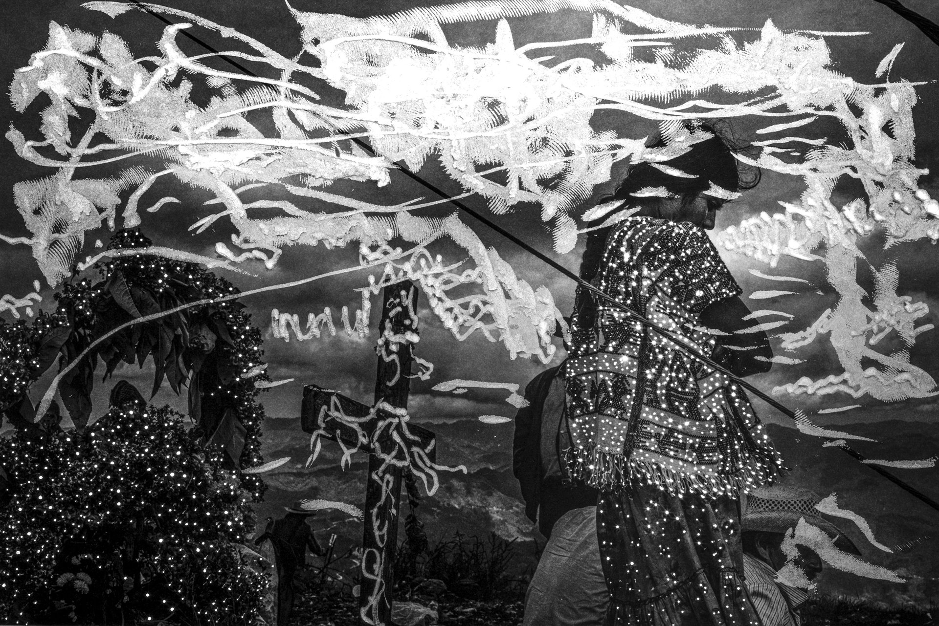 A woman stands near an altar after a celebration on the Cerro de la Garza in Guerrero, Mexico.