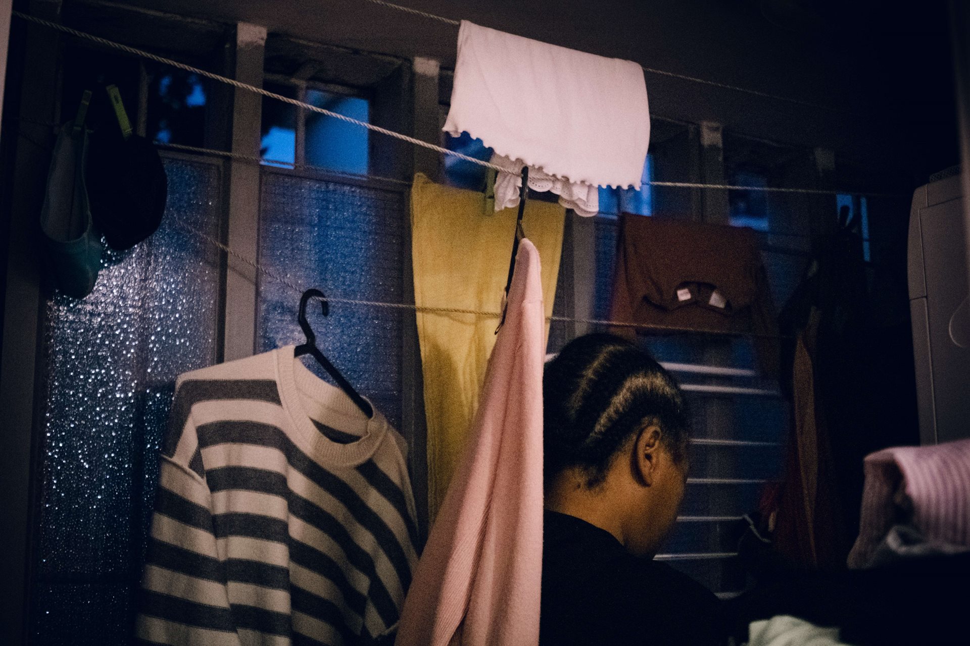 Ana Maria does the laundry of one of the families she works for, in Lisbon, Portugal.