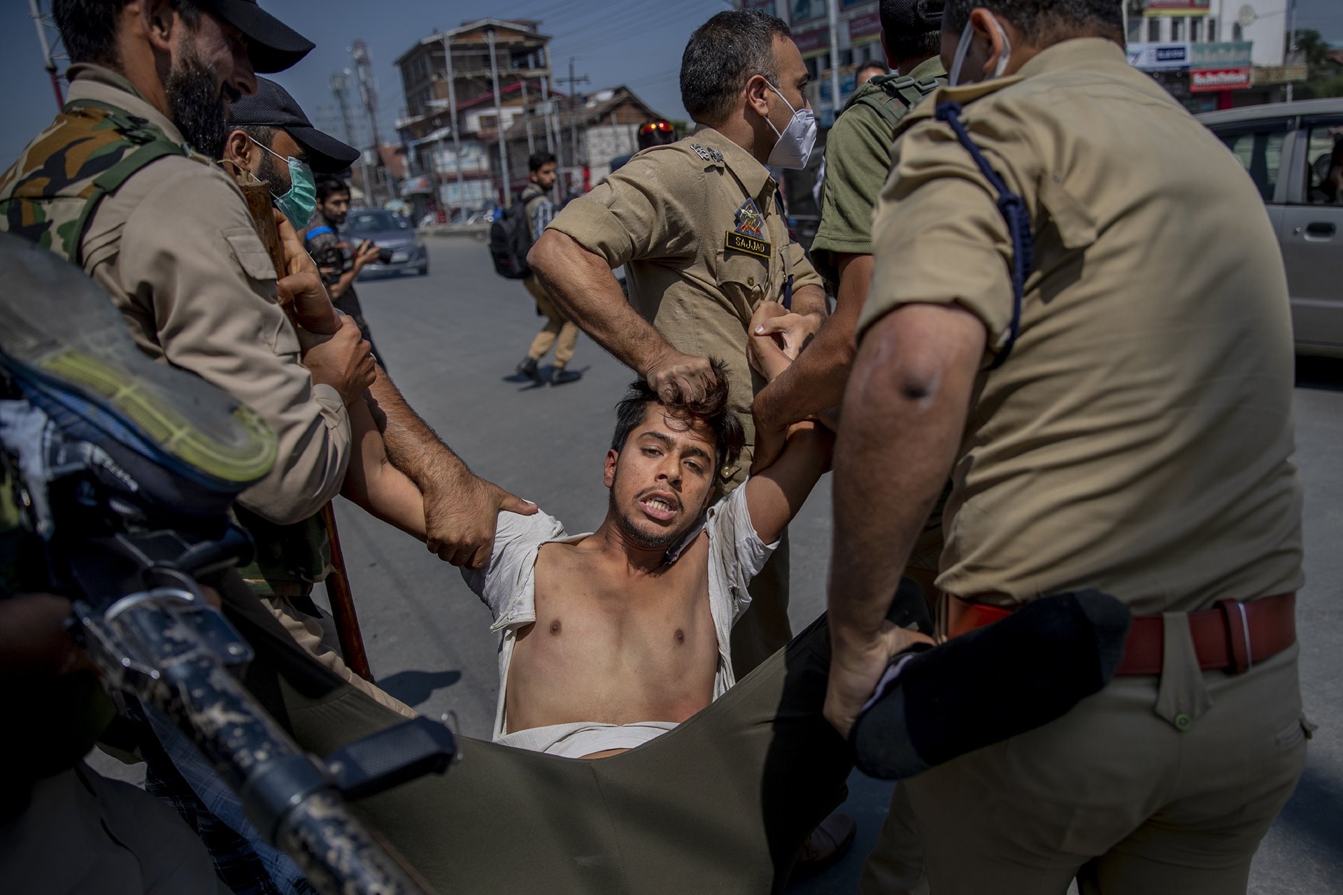 Indian policemen detain a man for participating in a religious procession in central Srinagar, Indian-administered Kashmir. Police fired tear gas and warning shots to disperse hundreds of Shia Muslims, while detaining dozens who attempted to participate in processions marking the holy month of Muharram.