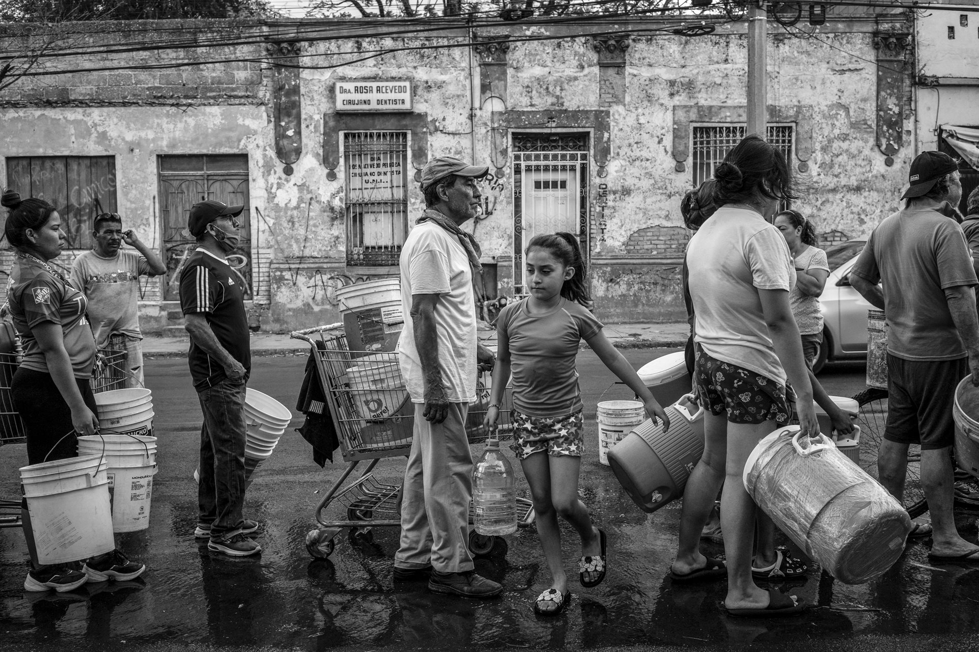 <p>Residents in Monterrey line up for water. Some blocked streets to demand water service. In response, large trucks delivered water daily to the city&rsquo;s most vulnerable neighborhoods. Nuevo Leon, Mexico<br />
<br />
&nbsp;</p>

