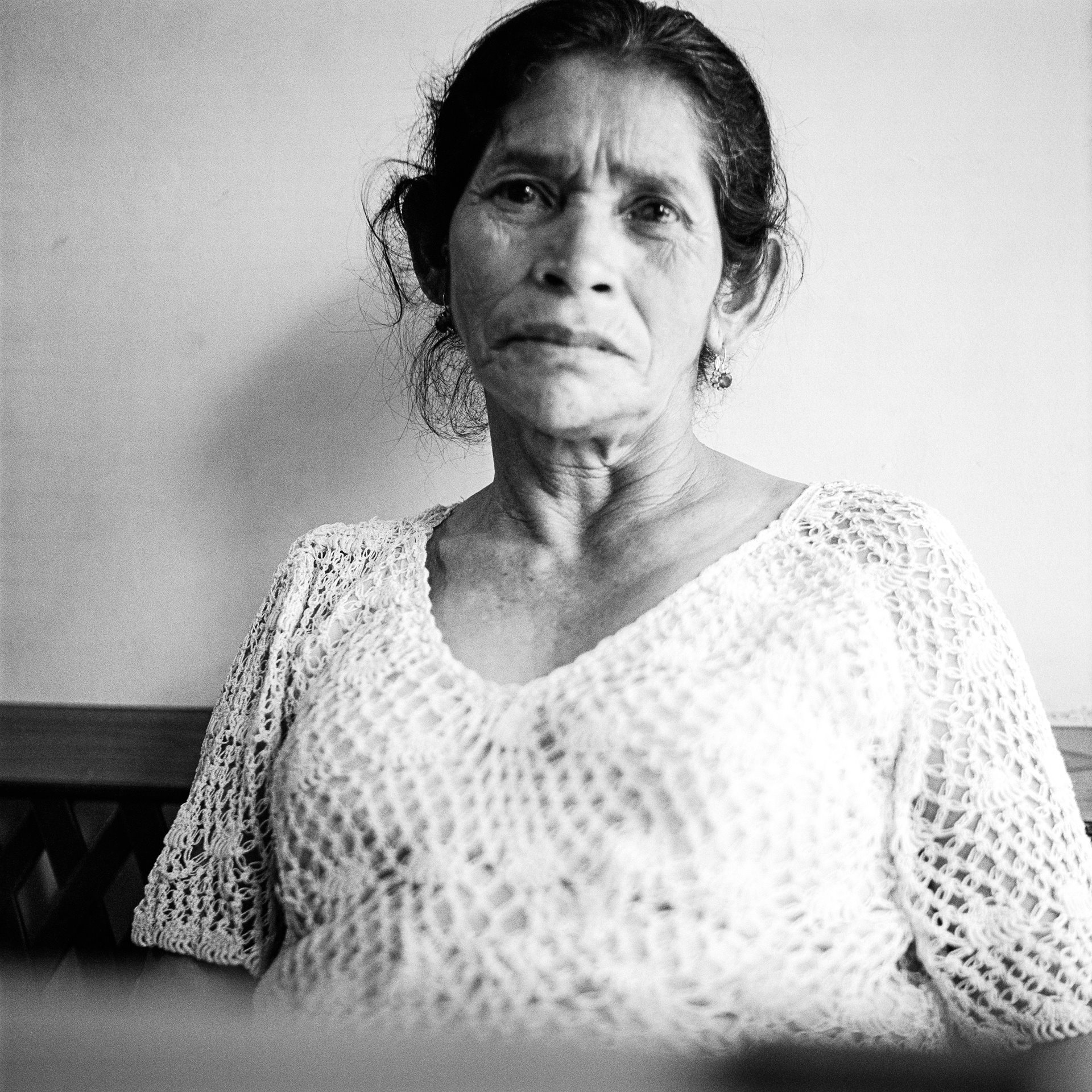 Doña Analigia wears a dress given to her by her son Roberto Antonio, before he was forcibly disappeared 16 years previously, at the age of 25. Doña Analigia and the association she belongs to, the Madres de la Candelaria, which assists people in tracing what has happened to the forcibly disappeared, say Roberto Antonio was tortured and killed by paramilitaries in the village of Toldas de Peque in Antioquia.