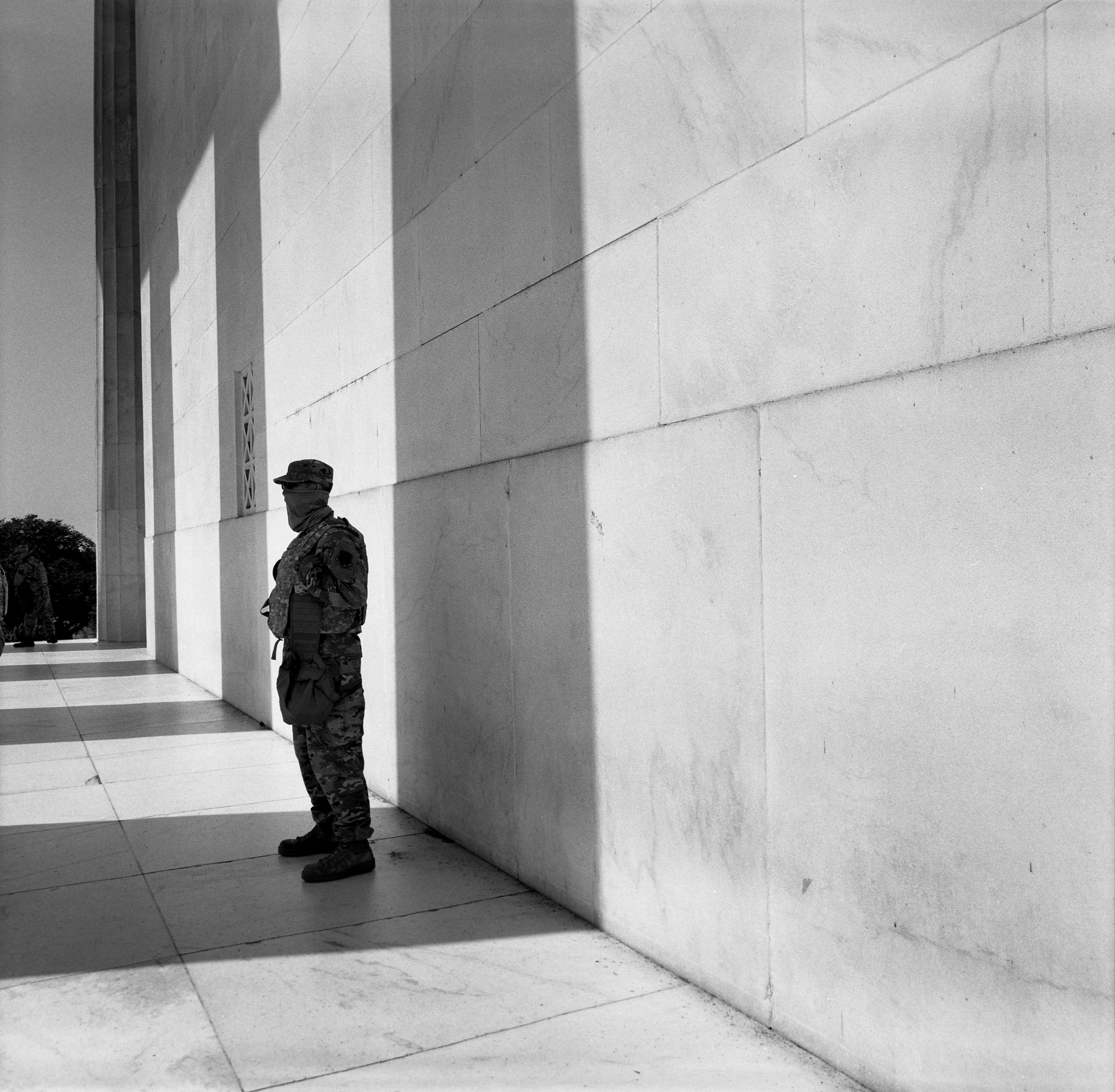 A member of the Washington DC National Guard stands in the shadow of one of the pillars of the Lincoln Memorial, in Washington DC, USA. The White House mobilized the National Guard and numerous federal and local law enforcement officers during growing protests related to the murder of George Floyd, a 46-year-old Black man, who died while being arrested by Minneapolis police two weeks earlier. US Army soldiers were moved to bases near Washington DC and put on alert, but not deployed.&nbsp;