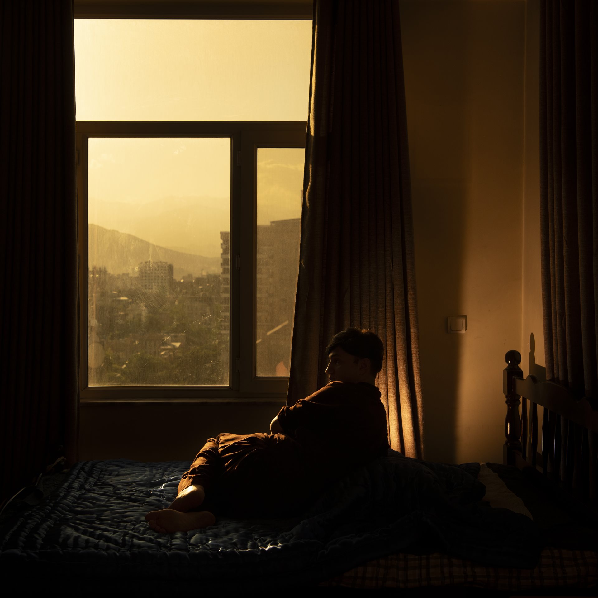 Samir (30), a trans woman in Kabul, dresses as a woman in private, but presents as a man in public, due to the danger and stigma of being LGBTQI+ in Afghanistan. Samir has faced arrest and torture by the Taliban, and pressure from family members to marry.